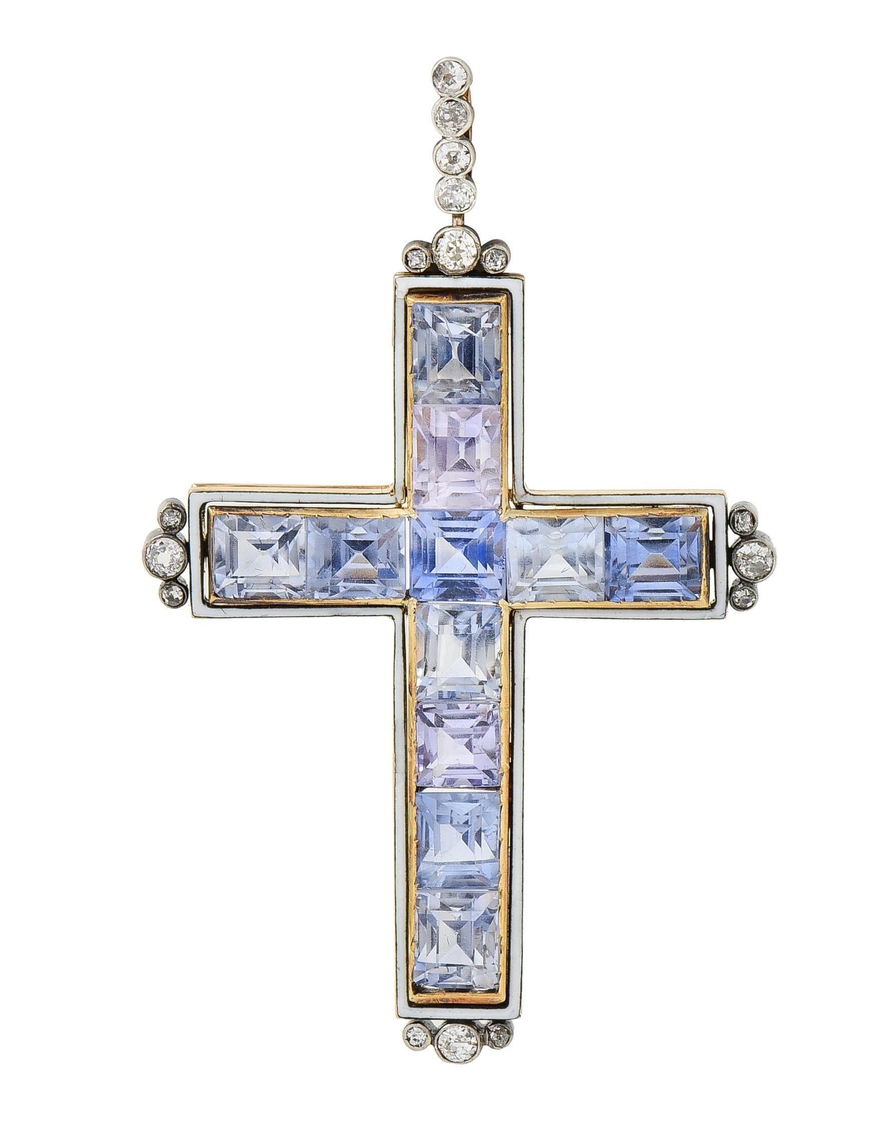 Featuring rectangular mixed-cut sapphires channel set in cross-formation
Weighing approximately 20.24 carats total - ranging in color 
Transparent light grayish blue, light blue, and light lavender 
With a floating halo of opaque white enamel -