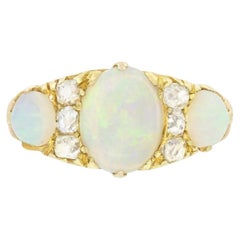 Anello vittoriano a tre pietre con opale e diamanti da 2,10ct, 1880 ca.