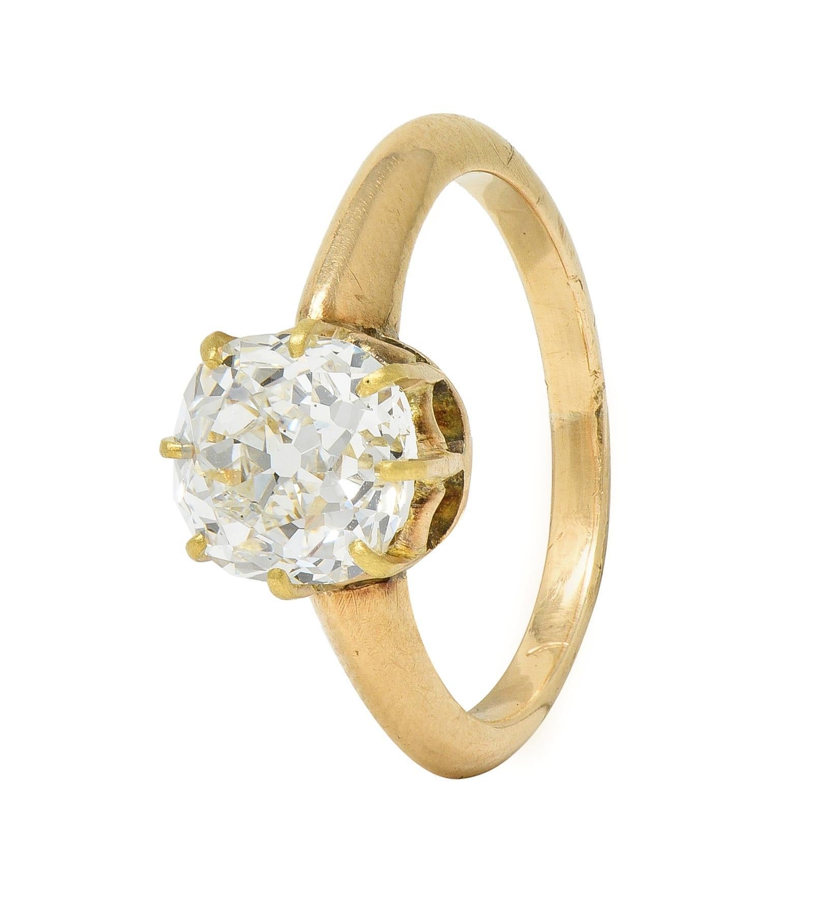 Centering an old mine cut diamond weighing 2.11 carat - G color with SI1 clarity
Set in an eight pronged mounting with pierced arch motif gallery 
Flanked by subtle knife edge shoulders
Tested as 14 karat gold
Circa: 1880s
Ring size: 5 and