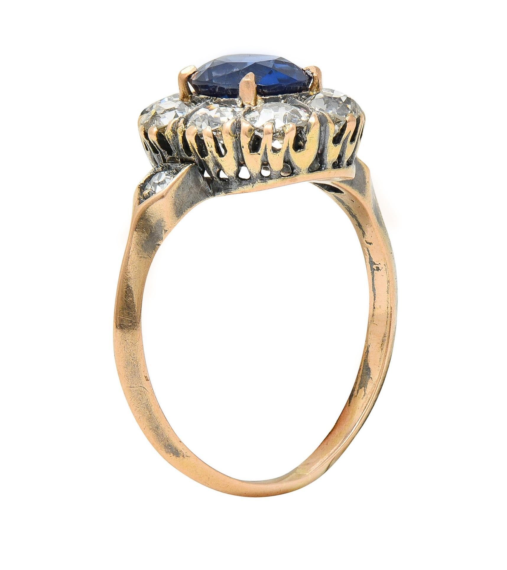 Centering a cushion-shaped sapphire weighing 1.16 carats total - transparent deep vivid blue
Natural Burmese in origin and displaying no indications of heat treatment 
Prong set with a halo surround of old mine cut diamonds 
With additional diamonds