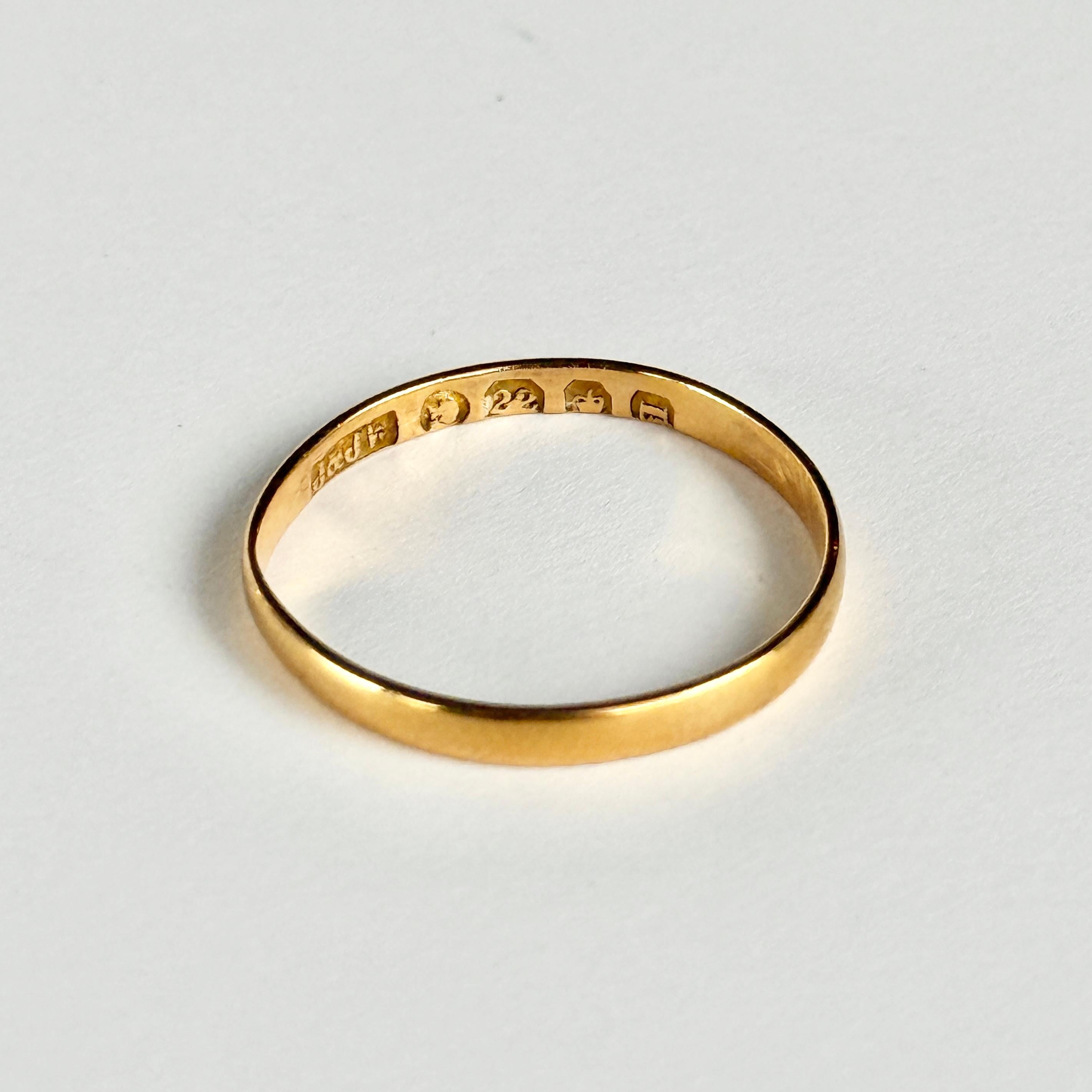 Glossy 22ct gold band. Perfect for a wedding band or just a simple everyday piece. Hallmarked London 1884.

Ring Size: L 1/2 or 6
Band Width: 2mm
Height off finger: 0.5mm

Weight: 1.2g
