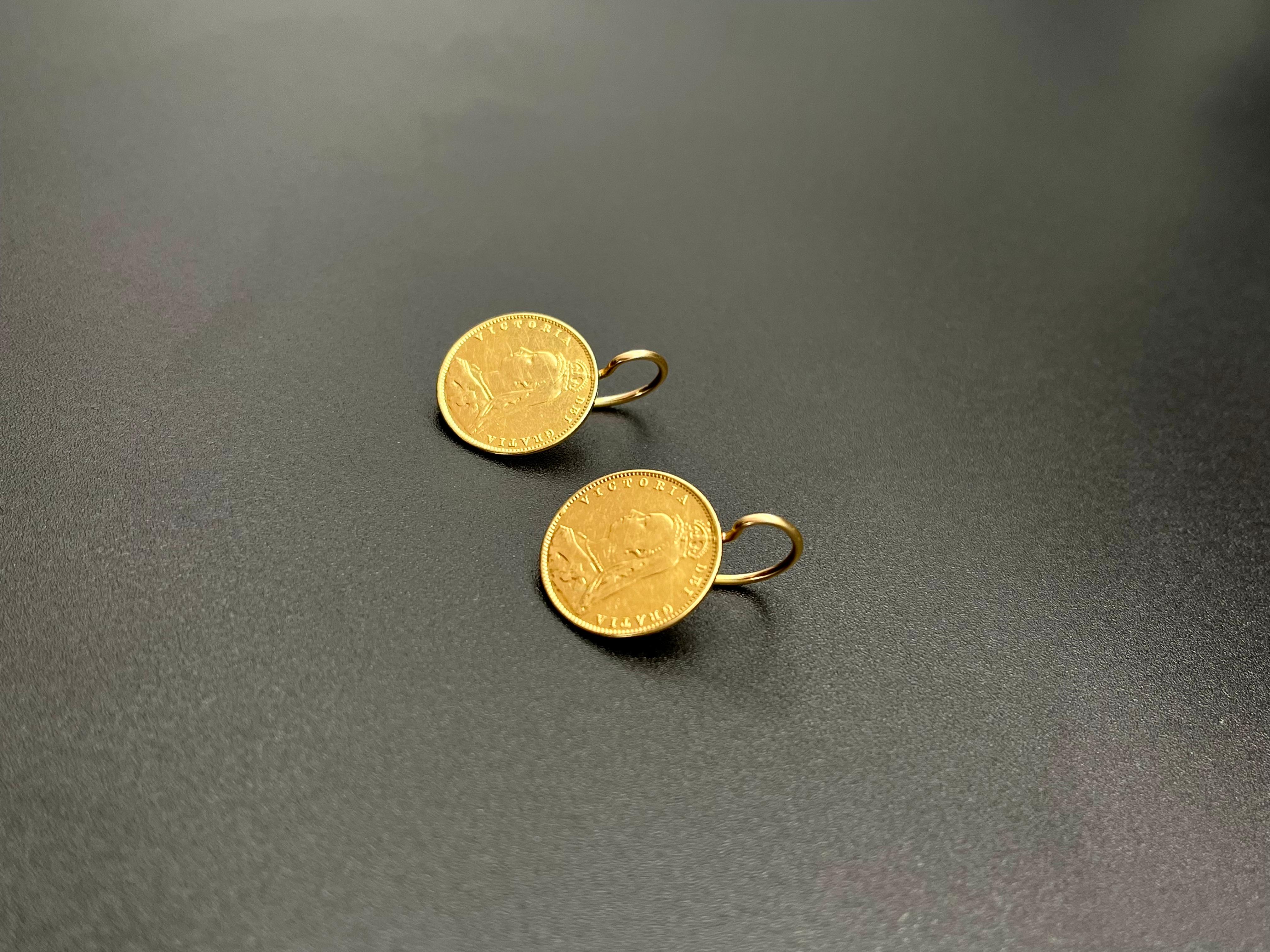 Two Antique British Victorian half pound Sterling gold coins in 22 karat gold, in a Portuguese 19.2 Karat Gold frame and loop. 

The First Earring is made with a 1891 gold half-pound. 
The Second Earring is made with a 1892 gold half pound. 

