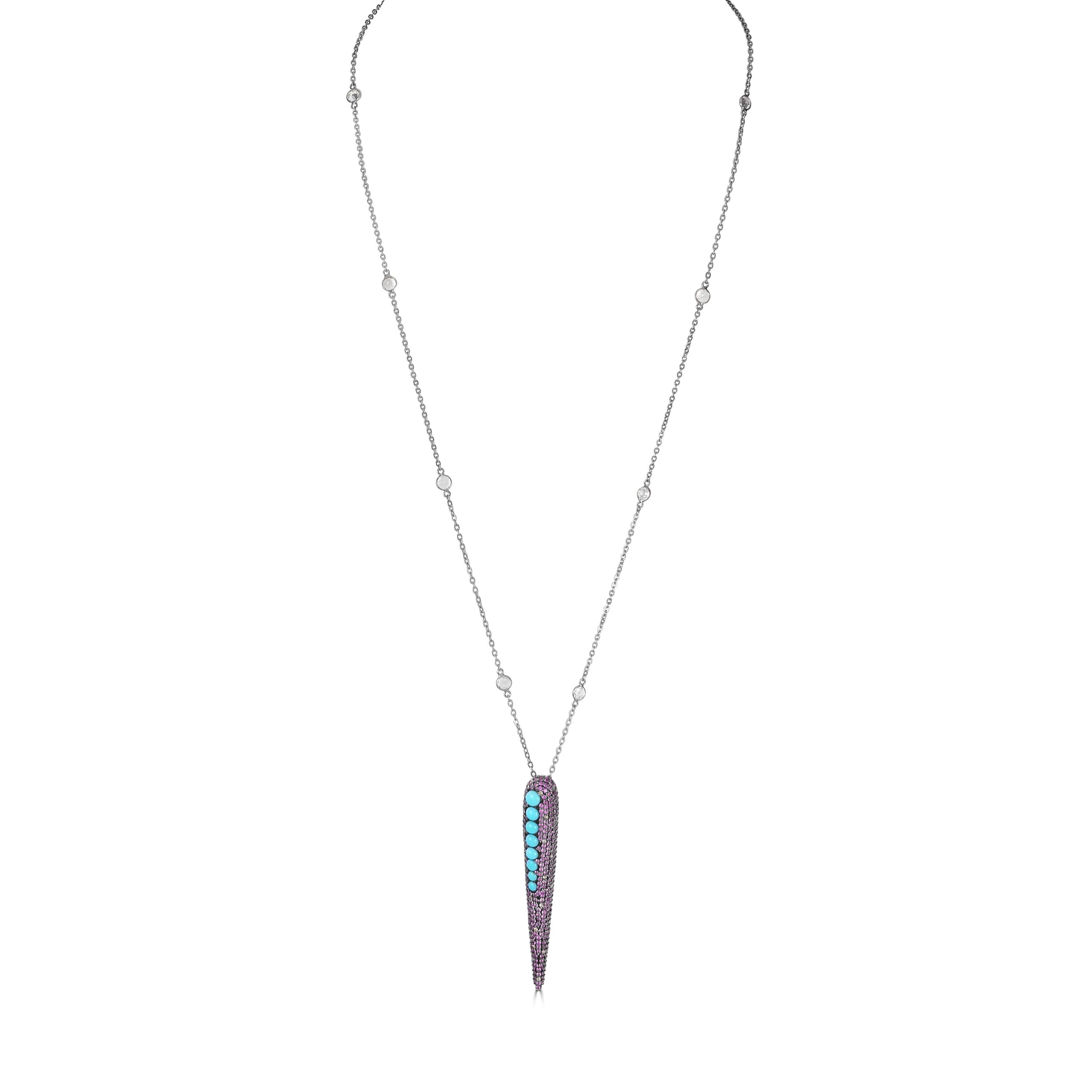 Introducing our Victorian 2.28 Cttw. Ruby, Turquoise, Topaz, and Diamond Pendant Necklace, a captivating piece that effortlessly blends elegance with bold design elements.

This exquisite pendant necklace features a 35-inch sterling silver cable
