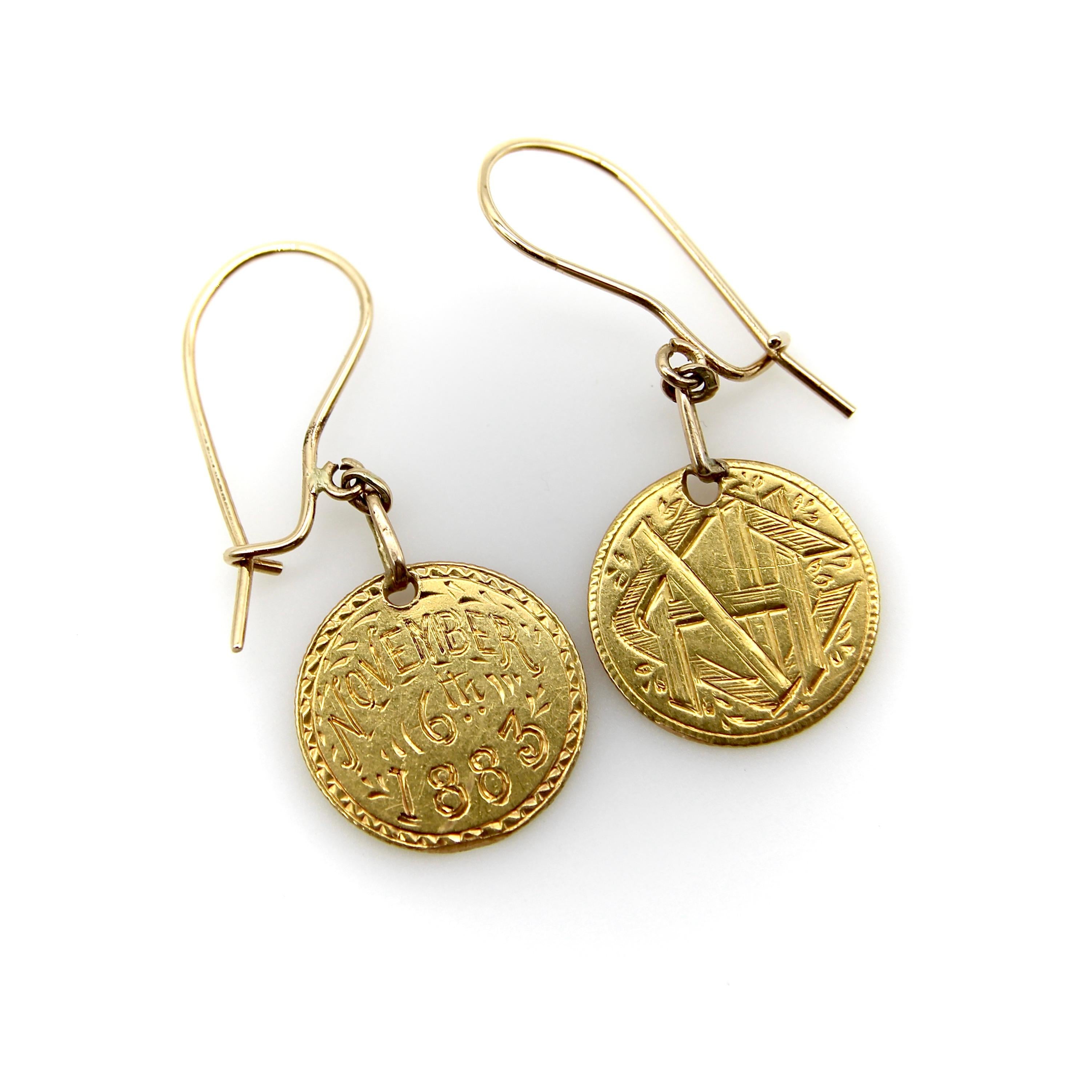 Circa 1883, these 22k gold earrings have an interesting and poetic history. Originally coins, they were hand engraved to become sentimental gifts called “love tokens,” a popular tradition of the 19th century. These coins are a matching, but slightly