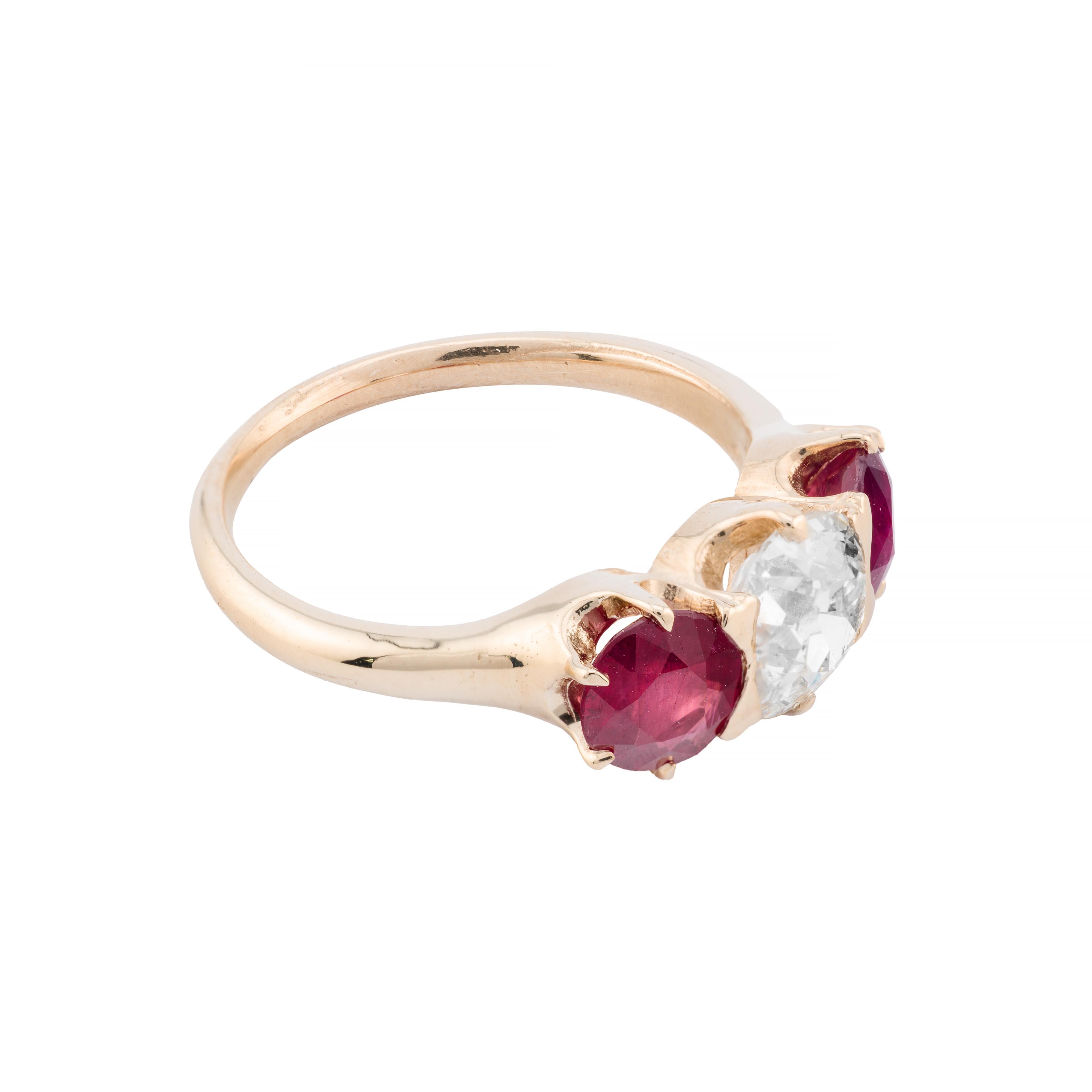 Aston Estate Jewelry Presents:

A distinguished Victorian engagement ring crafted in 14k yellow gold. The band showcases a central old mine cut diamond, weighing 1.10 carats, with a clarity of SI1 and an H color grade. Flanking the diamond are two