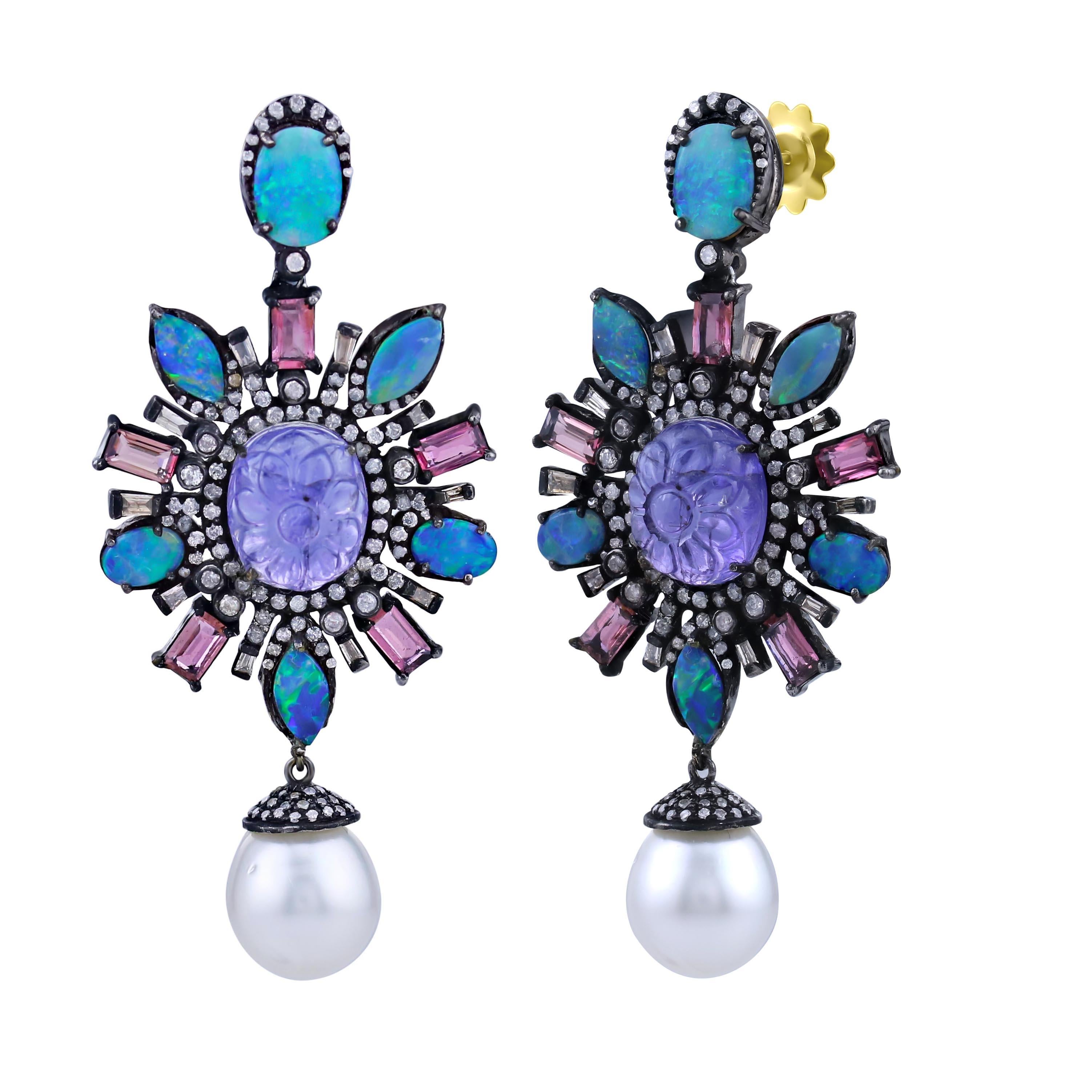 Feast on colors and glamour with these stunning Victorian 25.5 Ct. t.w. Tanzanite, Tourmaline, Opal and Diamond Dangle Earrings by Gemstiry, featuring a gorgeous oval tanzanite at the center, surrounded by a halo of diamonds and rays of opal and