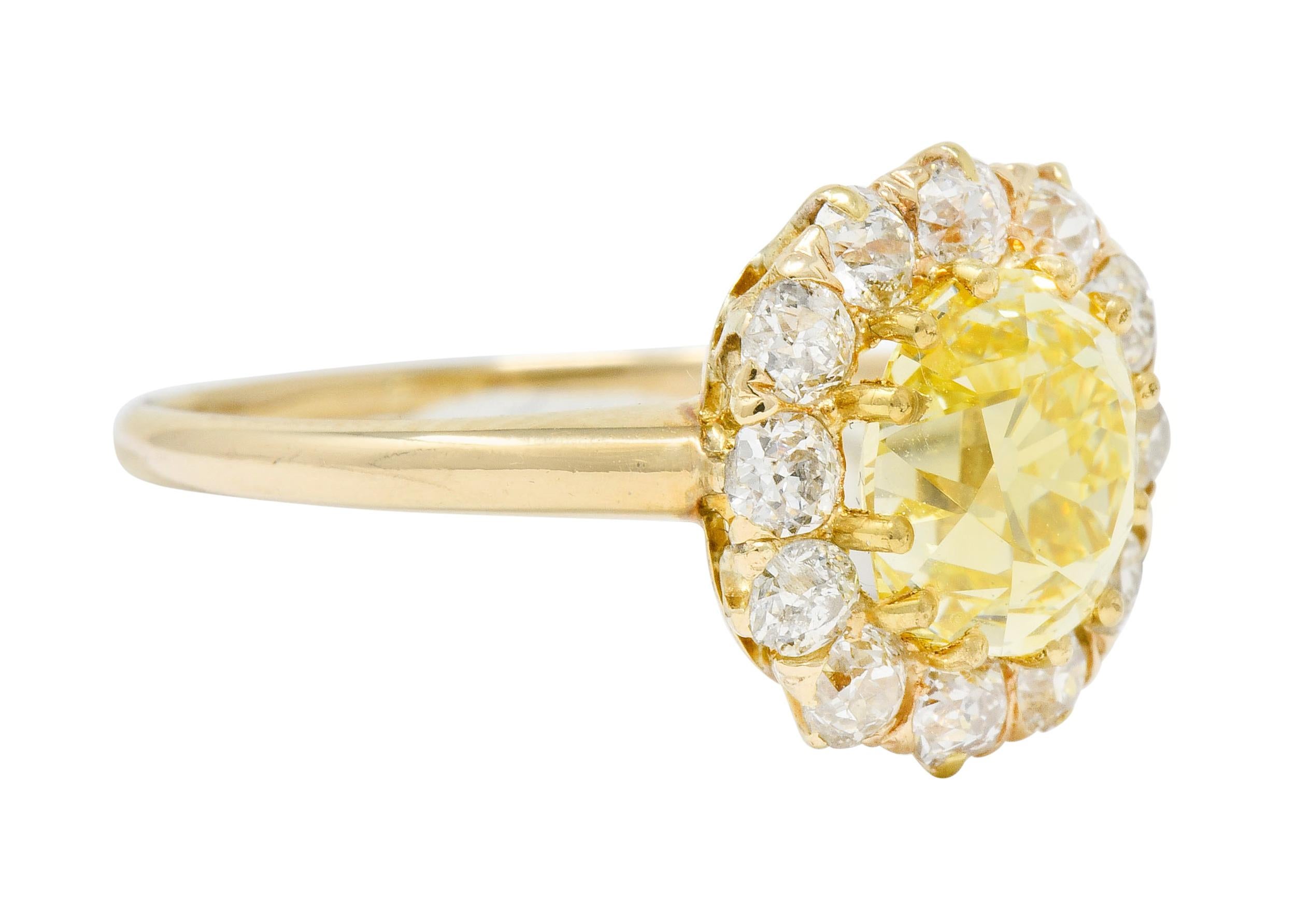 Centering an old mine cut natural fancy yellow diamond weighing 2.09 carats, with VS1 clarity

Surrounded by old European cut diamonds weighing approximately 0.50 carat total; I to M color with SI to I clarity

Tested as 14 karat gold

Circa:
