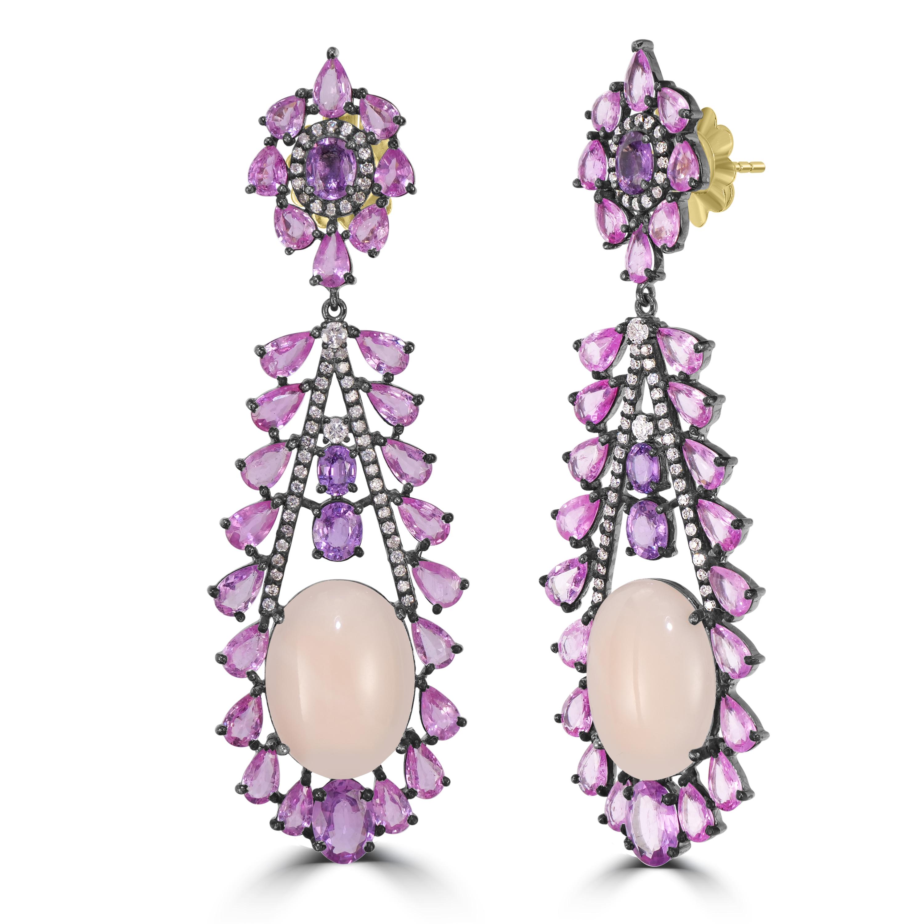 Step into a world of botanical elegance with our Victorian 27.85 Cttw. Peach Coral, Diamond, and Multi Sapphire Floral Dangle Earrings. A true floral masterpiece, these earrings capture the essence of a blooming garden with meticulous craftsmanship