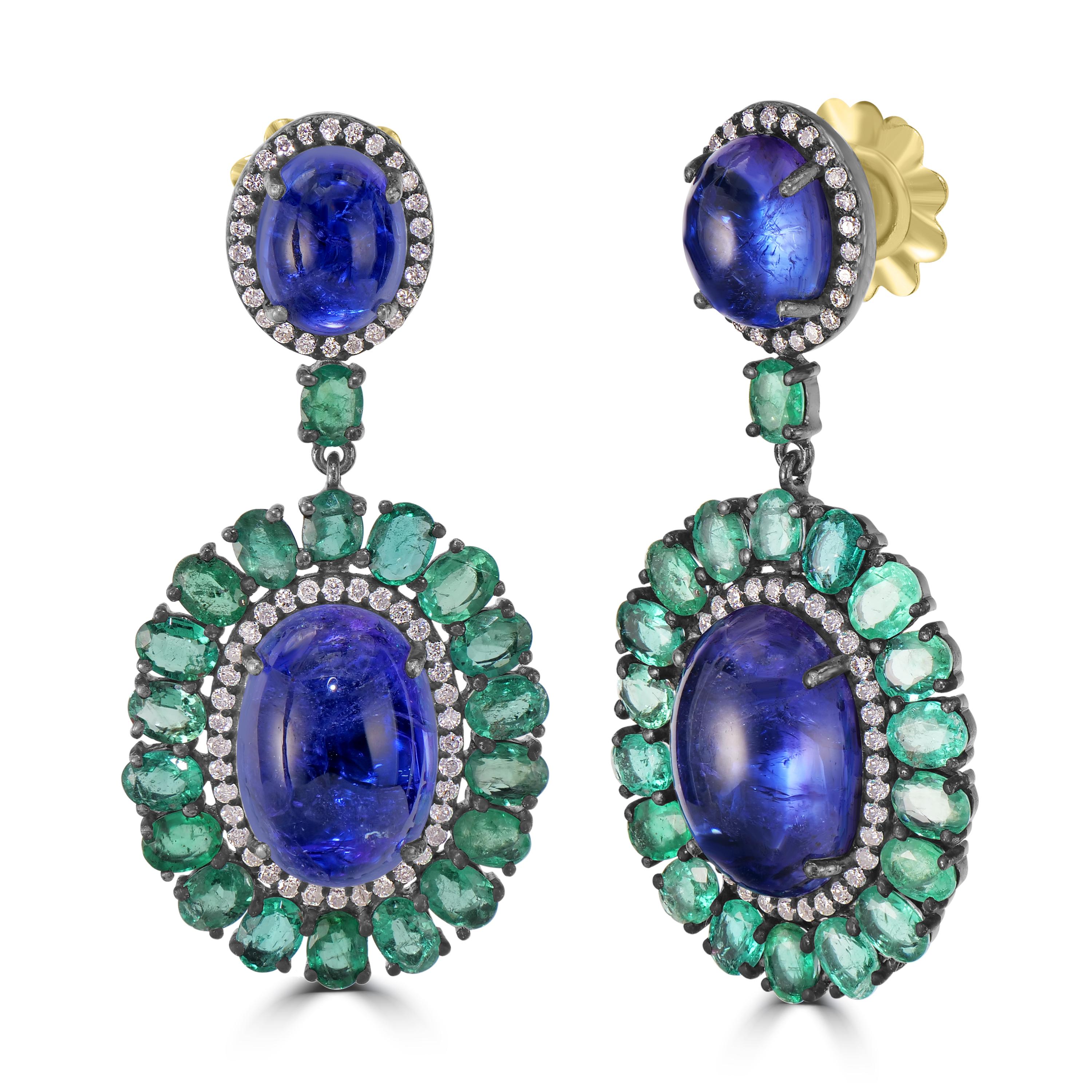 Introducing our Victorian 27.85 Cttw. Tanzanite, Diamond, and Emerald Dangle Earrings—a botanical masterpiece that captures the essence of nature's elegance and the allure of precious gemstones.

At the core of these enchanting earrings is an oval