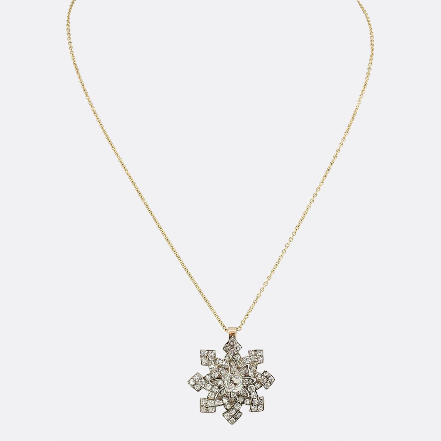 This is a wonderful Victorian diamond star pendant. The focal point of the pendant is a stunning 1.03 carat old cushion cut diamond that sits slightly raised in the centre. Surrounding this diamond there are 72 smaller old cut diamonds which are
