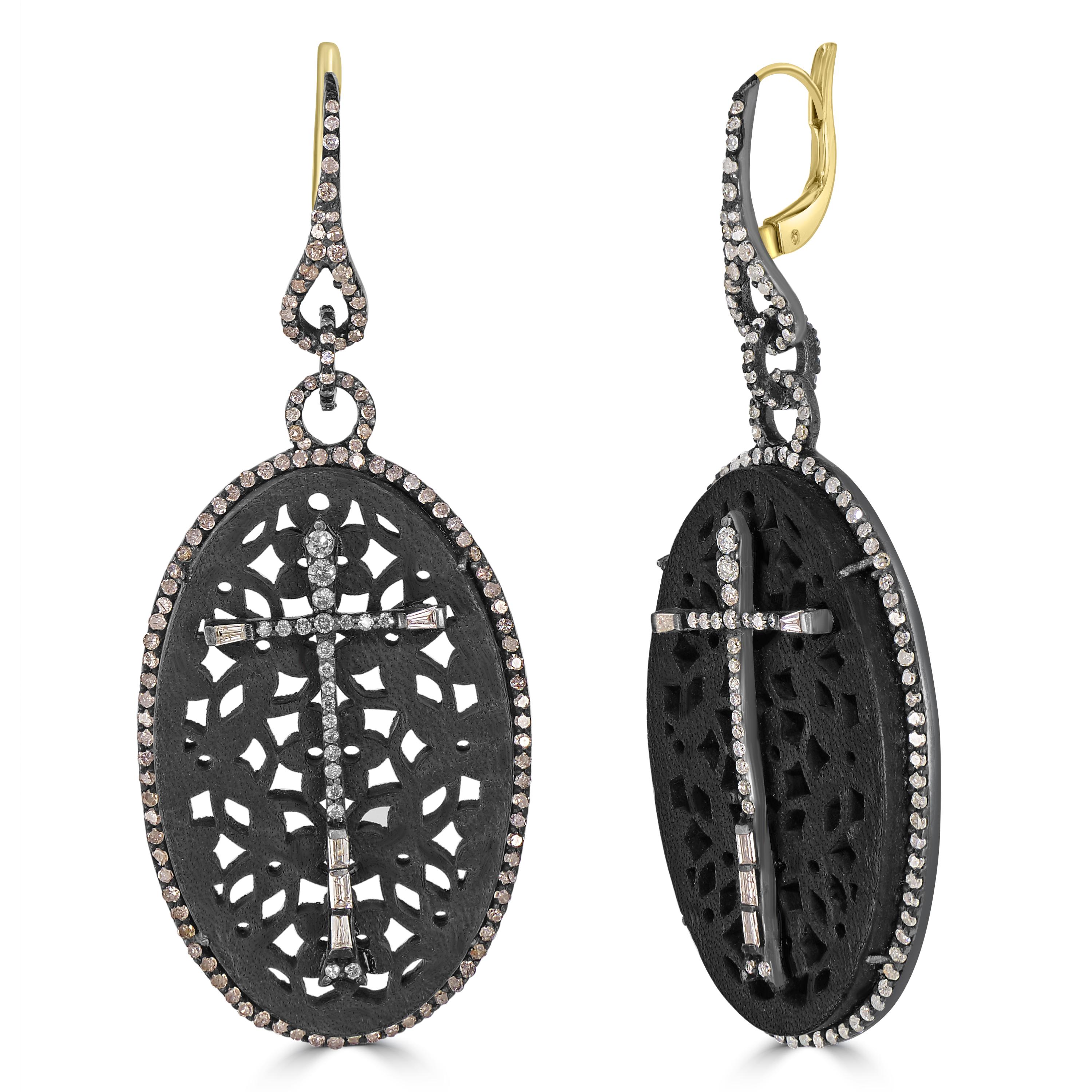 Dive into the allure of Victorian elegance with the 3.19 Cttw. Filigree Drop Earrings in 18k Gold and Sterling Silver. These exquisite earrings feature an oval drop crafted from luxurious black leather, adding a touch of sophistication and