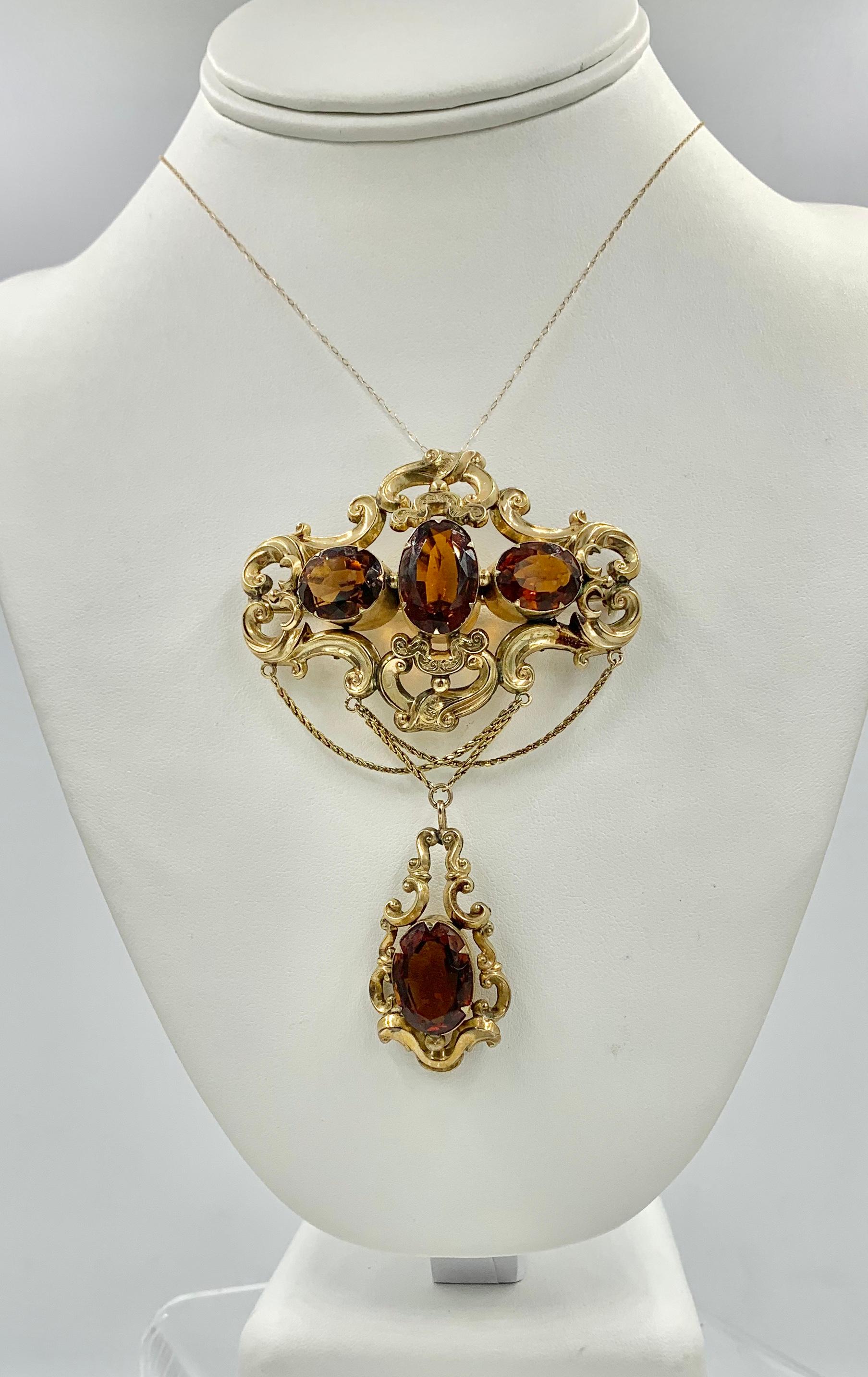 This is a spectacular antique Victorian - Belle Epoque Pendant Brooch with 30 Carats of Magnificent Citrine gems set in a stunning open work acanthus scroll swag design in 10-12 Karat Gold.  The pendant is a monumental size, 4 1/8 inches long, which