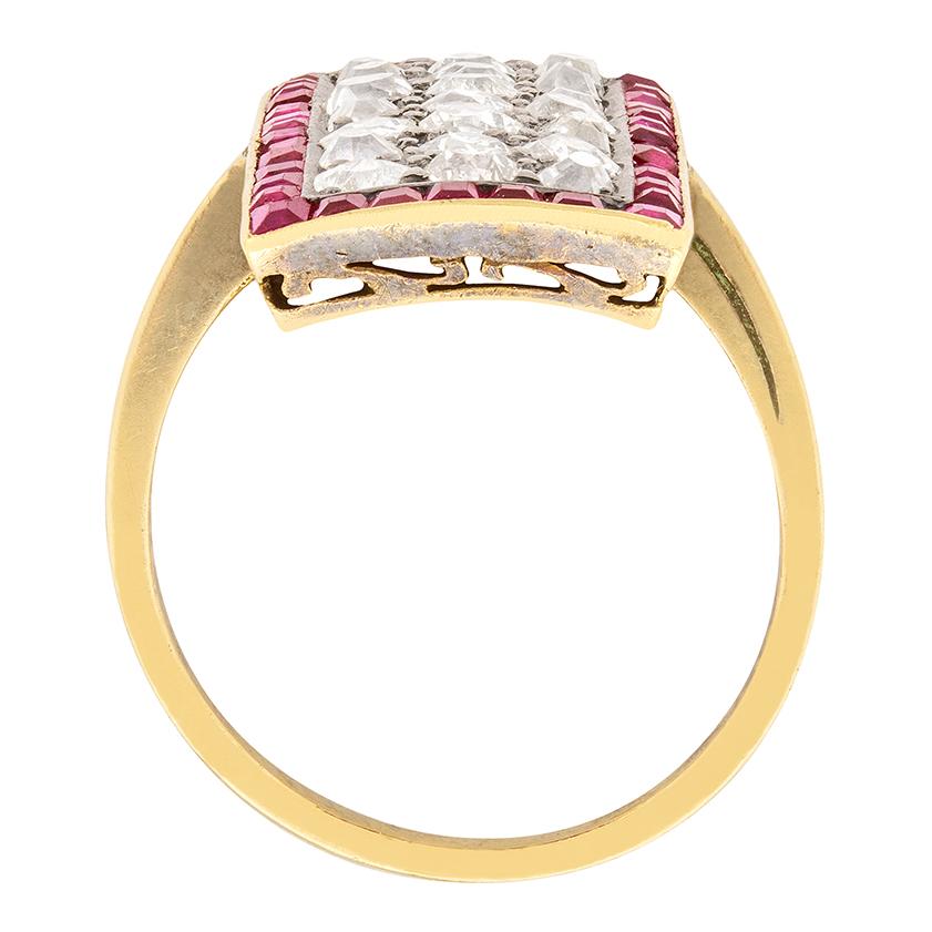 This stunning Victorian ring is perfect for special occasions. Twenty-one old cut diamonds form the centre, while thirty-eight baguette cut rubies line the outer edge. The diamonds total to 3.00 carat, and are I to J in colour and VS to SI in