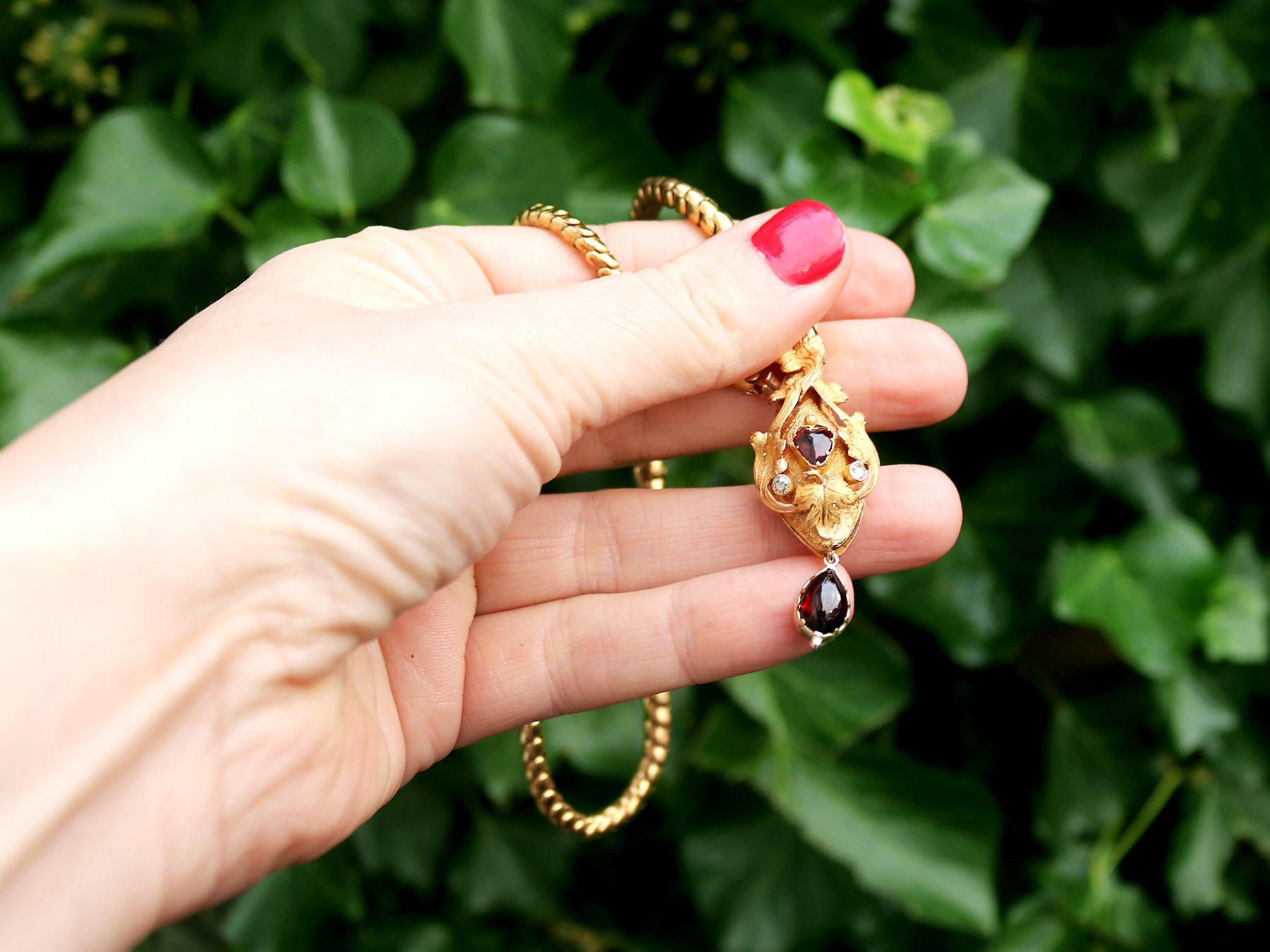 A stunning, fine and impressive antique Victorian 3.06 carat garnet and 0.13 carat diamond, 21 karat yellow gold necklace in the form of a snake; part of our diverse antique jewelry and estate jewelry collections.

This stunning, fine and impressive