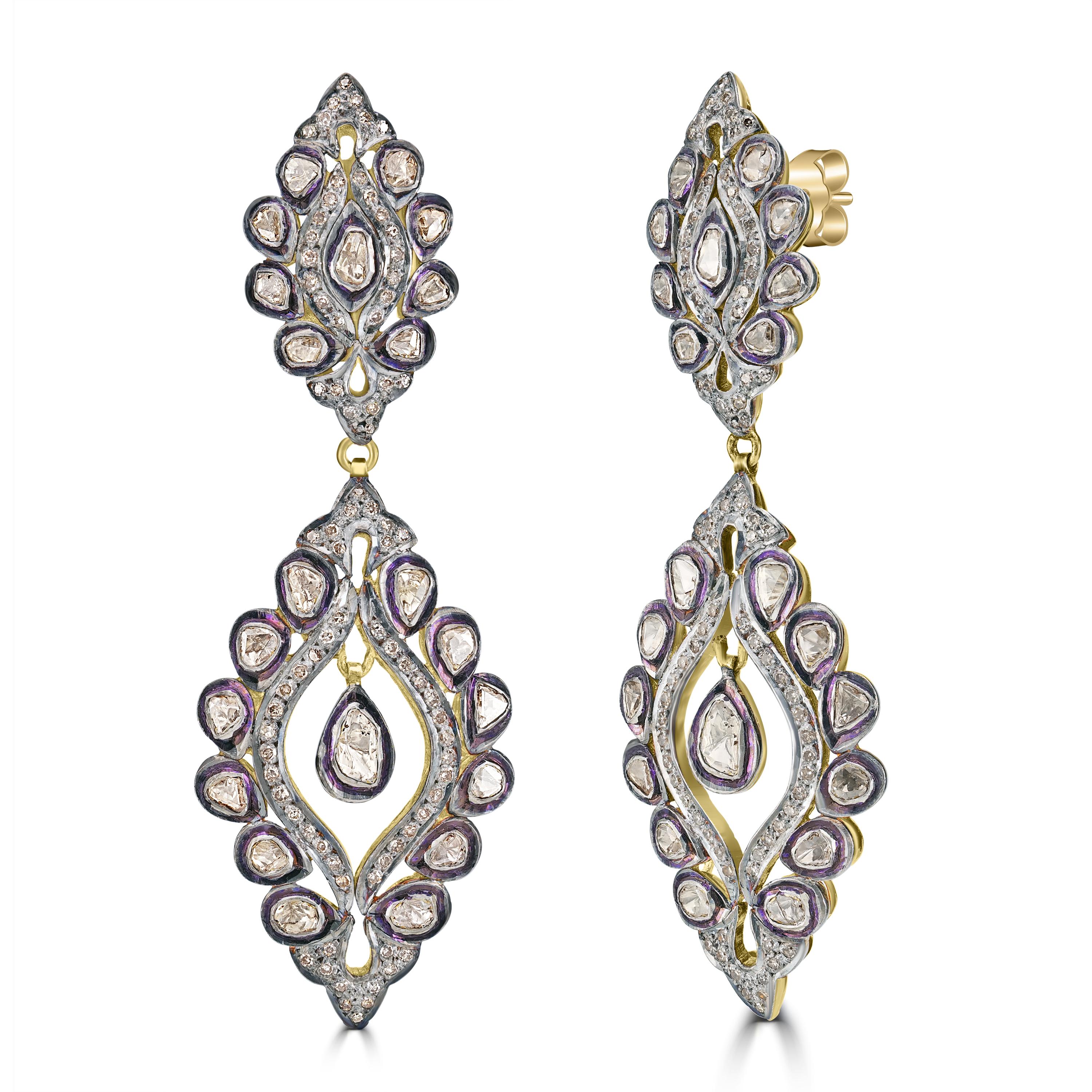 Introducing the Victorian 3.54 Cttw. Diamond Floral Dangle Earrings, a masterful blend of classic elegance and modern sophistication. These exquisite earrings are crafted from 18k yellow gold and sterling silver, adorned with black rhodium accents