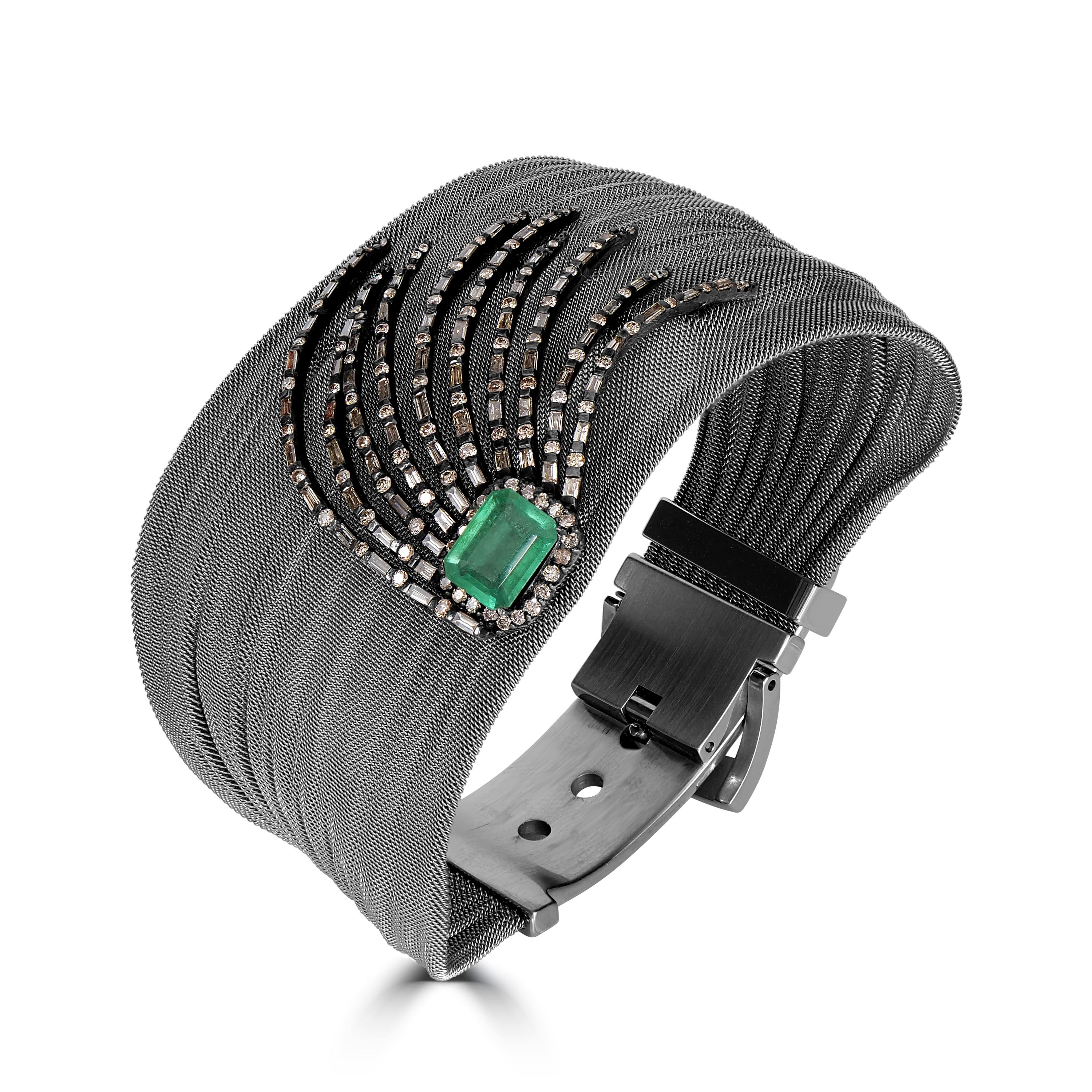 Step into the glamour of a bygone era with our Victorian Emerald and Diamond Retro Bracelet, a timeless piece of exquisite craftsmanship and unparalleled beauty.

At the heart of this bracelet lies a captivating central motif, showcasing a