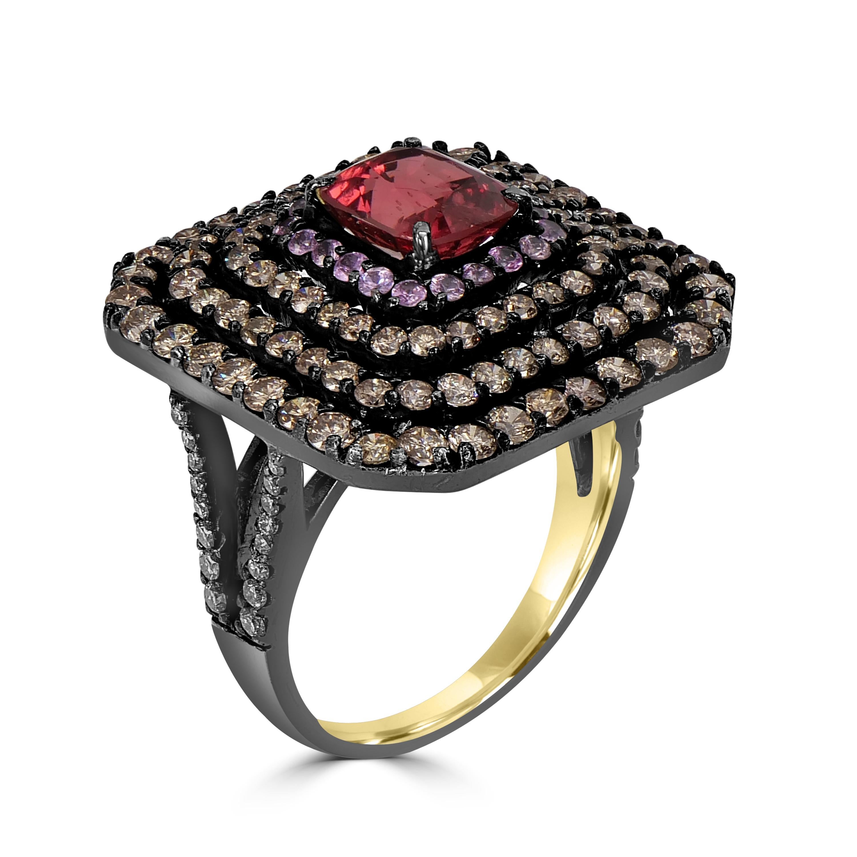 Indulge in the opulence of the Victorian 4.1 Cttw. Tourmaline, Pink Sapphire, and Diamond Cocktail Ring, a true masterpiece in 18k yellow gold, sterling silver, and black rhodium. This ring transcends ordinary jewelry, capturing the essence of