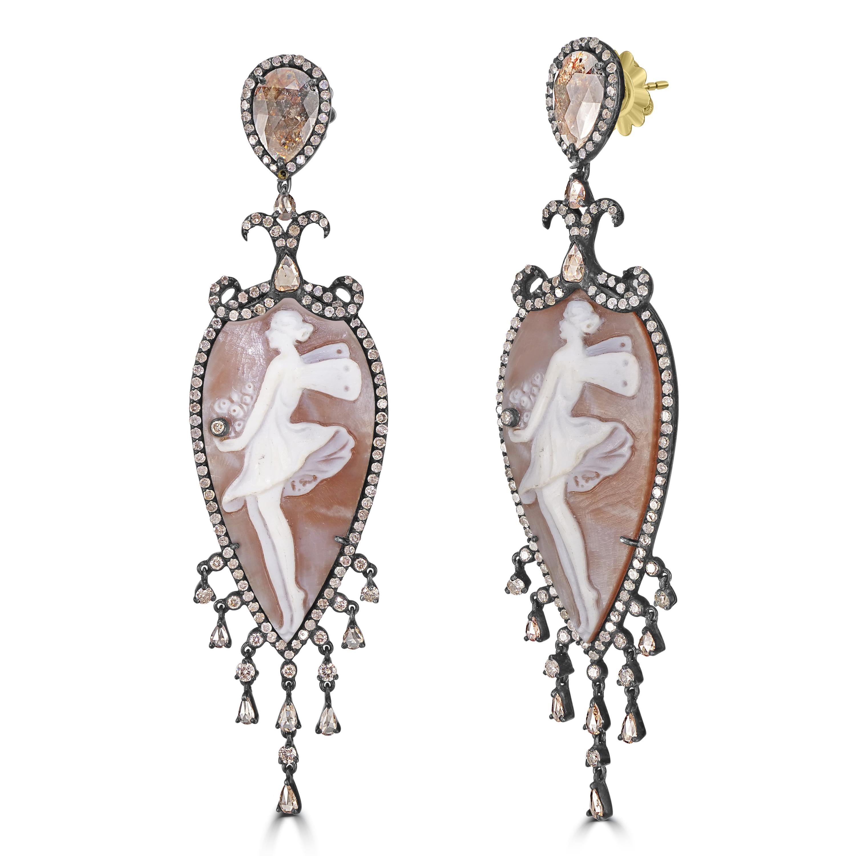 Introducing the opulent Victorian 42.1 Cttw. Brown Cameos and Diamond Chandelier Drop Dangle Earrings—a true embodiment of timeless elegance and sophistication.

These enchanting earrings feature a pear drop with a black rhodium frame adorned with