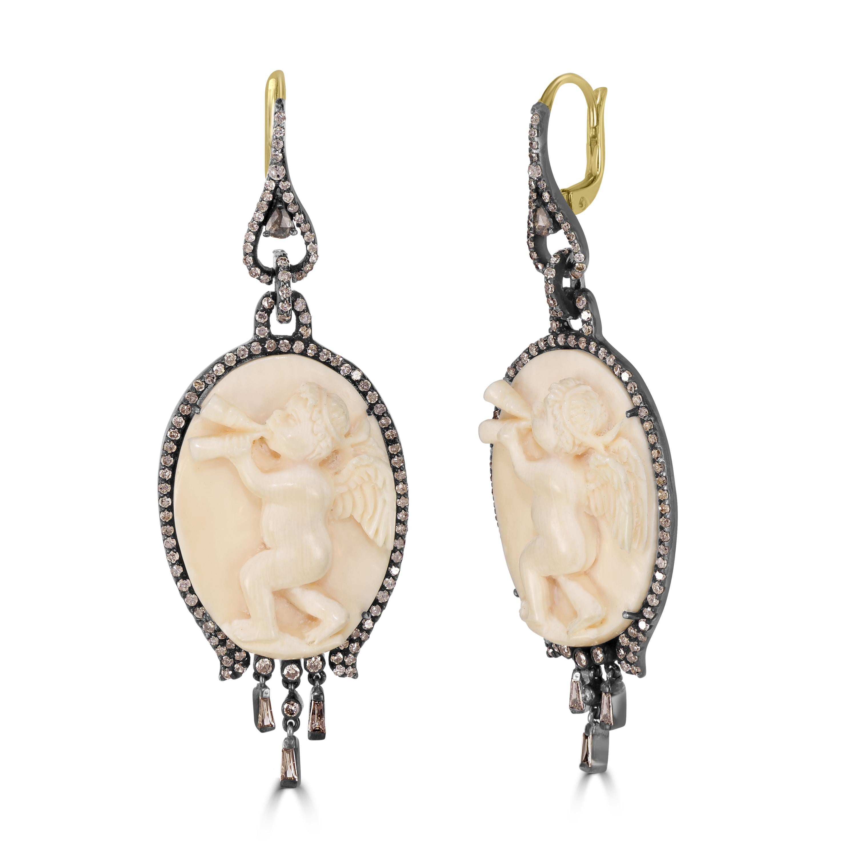 Introducing our Victorian 42.34 Cttw. Ivory Mammoth and Diamond Dangle Earrings – a unique and extraordinary piece of jewelry that exudes timeless elegance and charm.

These stunning earrings feature oval-shaped ivory Mammoth as the centerpiece,