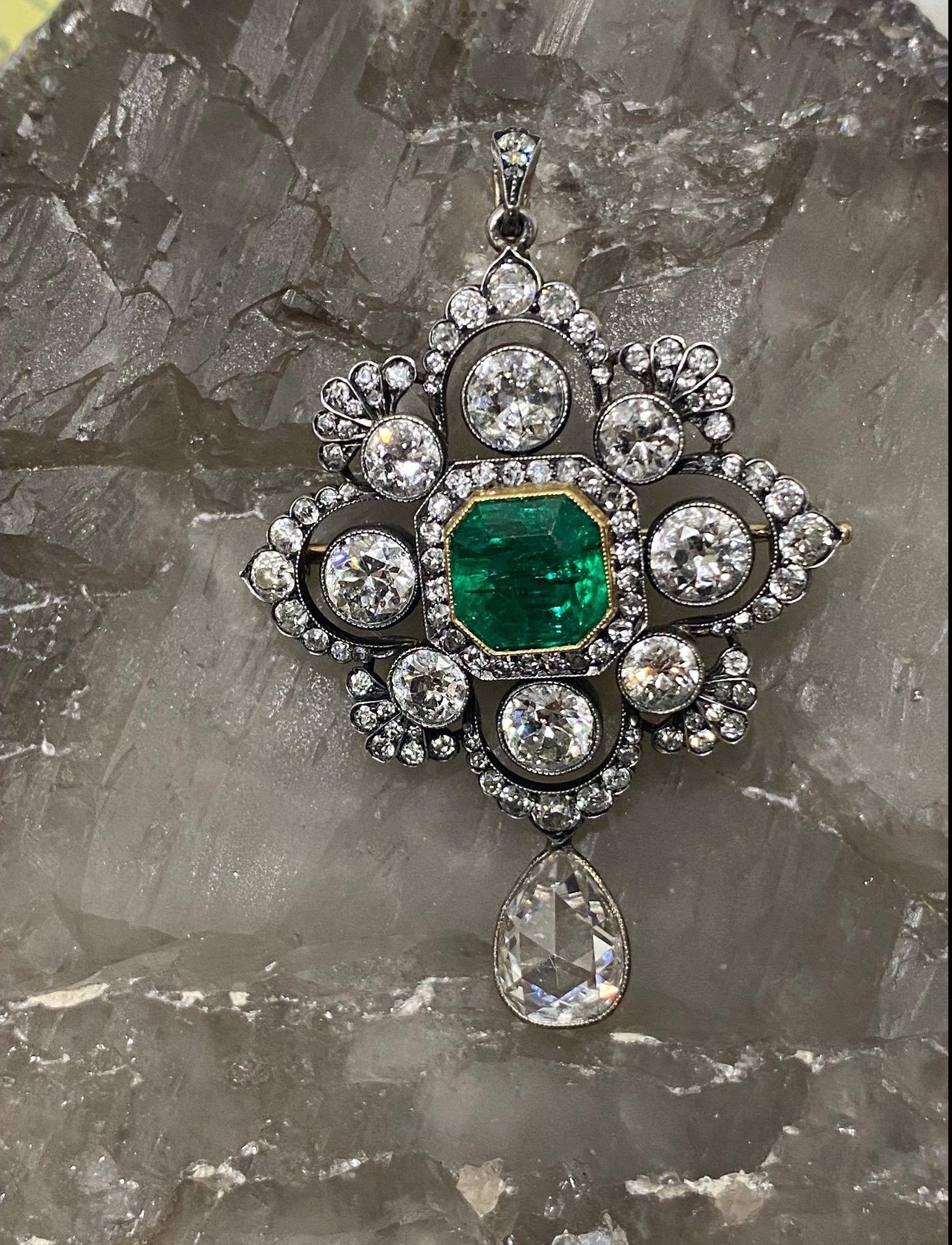 True to the Victorian period! This very fine Colombian Emerald & Old European Diamond pendant brooch is a forever heirloom piece. 

The pendant brooch is all original Victorian circa 1890’s. We have added at the bottom the dangling large 1.88 CTW