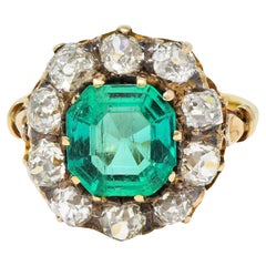 Victorian 4.28 CTW Colombian Emerald Diamond 18 Karat Yellow Gold Halo Ring GIA