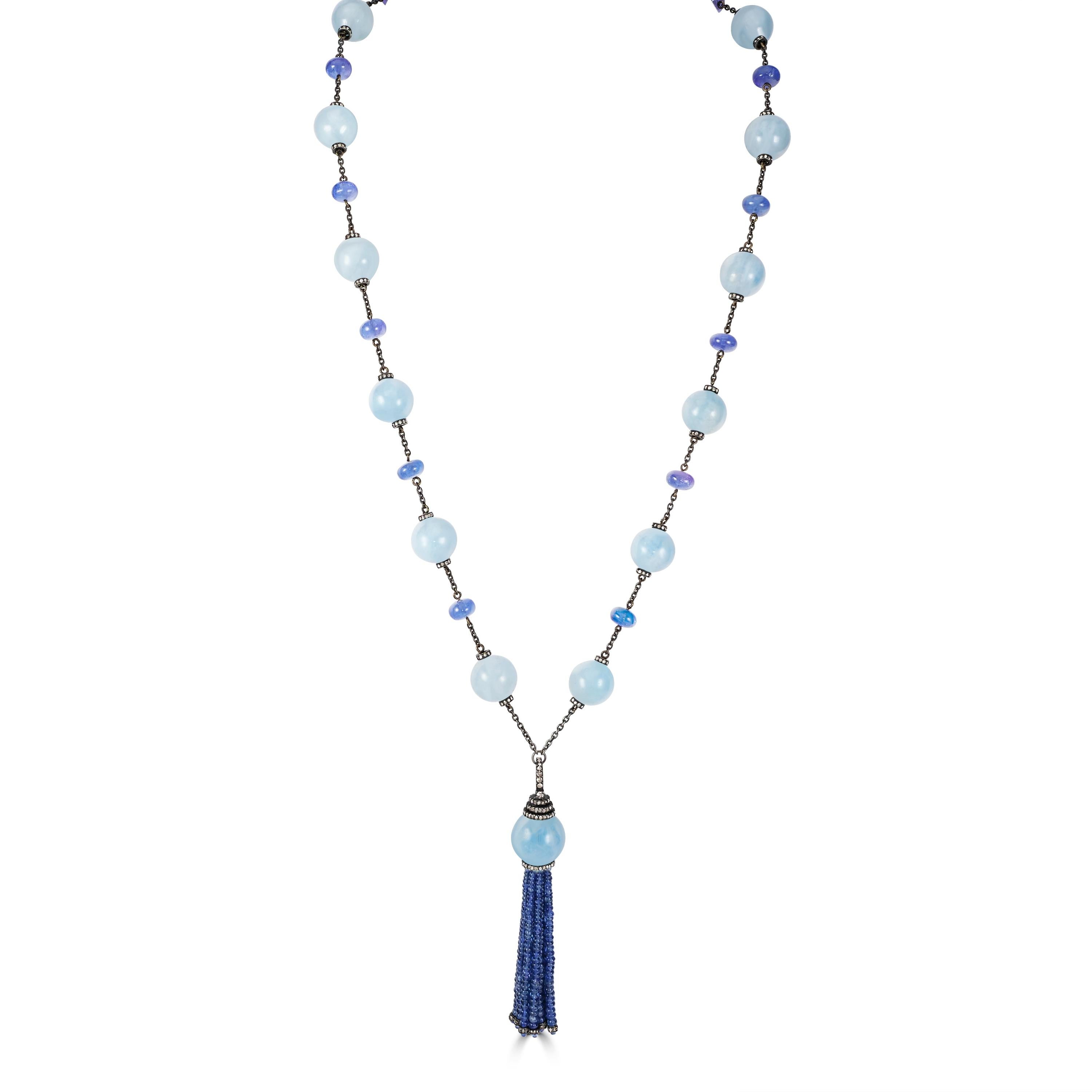 Introducing our opulent Victorian 439 Cttw. Milky Aquamarine , Blue Sapphire, and Diamond Tassel Necklace, a statement piece that epitomizes luxury and sophistication.

At the heart of this necklace is a magnificent tassel crafted from round blue