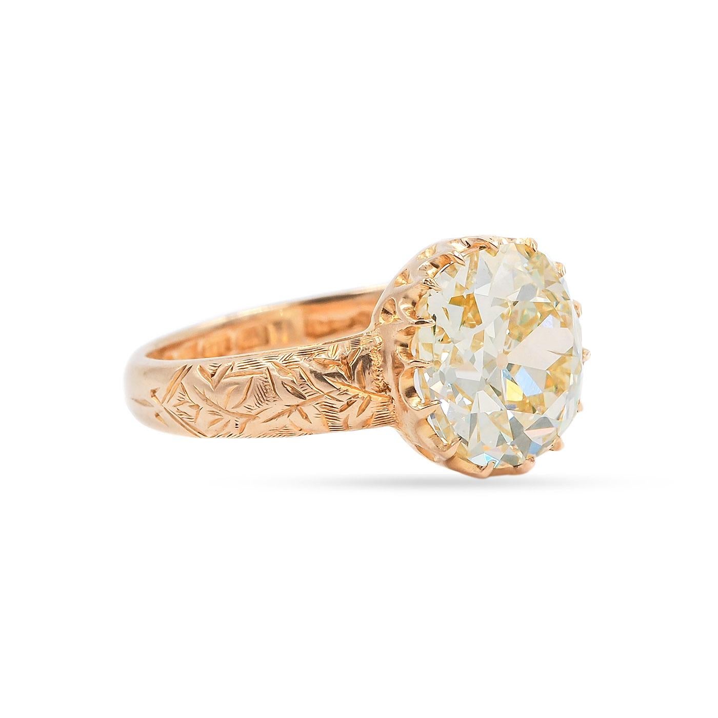 A Late Victorian era Solitaire Engagement Ring in bright & buttery 18k yellow gold. Featuring a rare 4.50 Carat Old Mine Cut Diamond. GIA certified Natural Fancy Yellow color/SI2 clarity. Diamond is a slightly elongated cushion-shape and is set in a