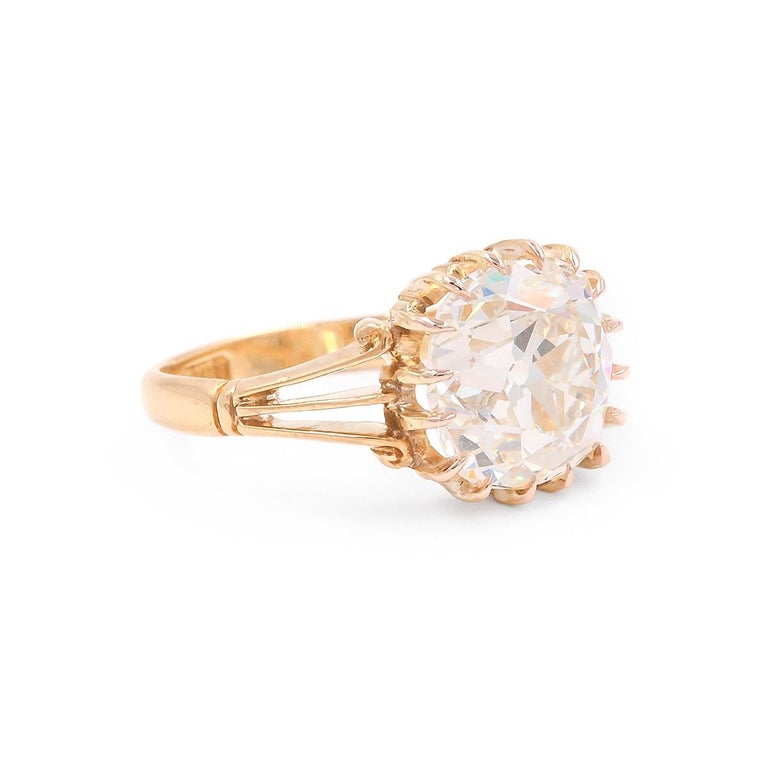 A magnificent Victorian era 4.68 Carat Old Mine Cut Diamond Engagement Ring composed of 18k yellow gold. The cushion shaped stone is GIA certified to be K color & SI1 clarity. Set in a multi-claw prong setting, with cutout details to the slightly