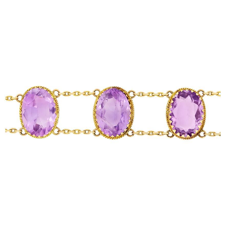 Six stunning oval cut amethysts totalling 48 carats feature in this bracelet from the Victorian era. Each emerald is linked together with 9 carat rose gold chain. The bracelet if finished with a wonderfully ornate clasp featuring scroll work. The