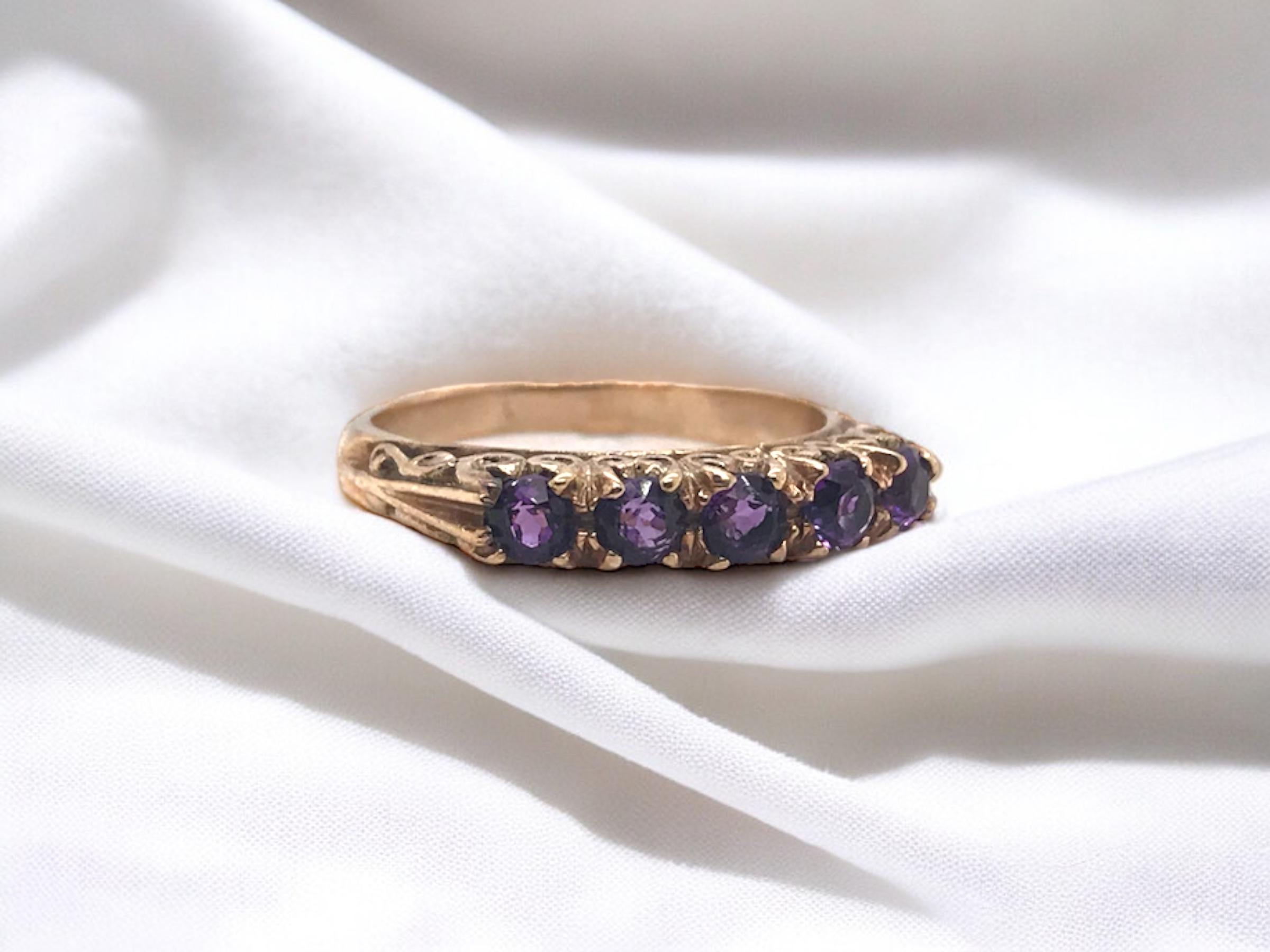 We love the scrollwork design on this vintage beauty!

Ring Details
Era: Victorian 1840 - 1900
Material: 9K Rose Gold
Shank Width: 3.0mm Tapering to 2.3mm
5 - 3.0mm Amethyst Gemstones
Height Off Finger: 4.0mm
Weight: 2.9 Grams
Finger Size: 6 1/2