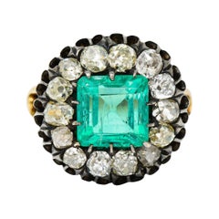Victorian 5.25 Carats Emerald Diamond Silver-Topped 18 Karat Gold Cluster Ring