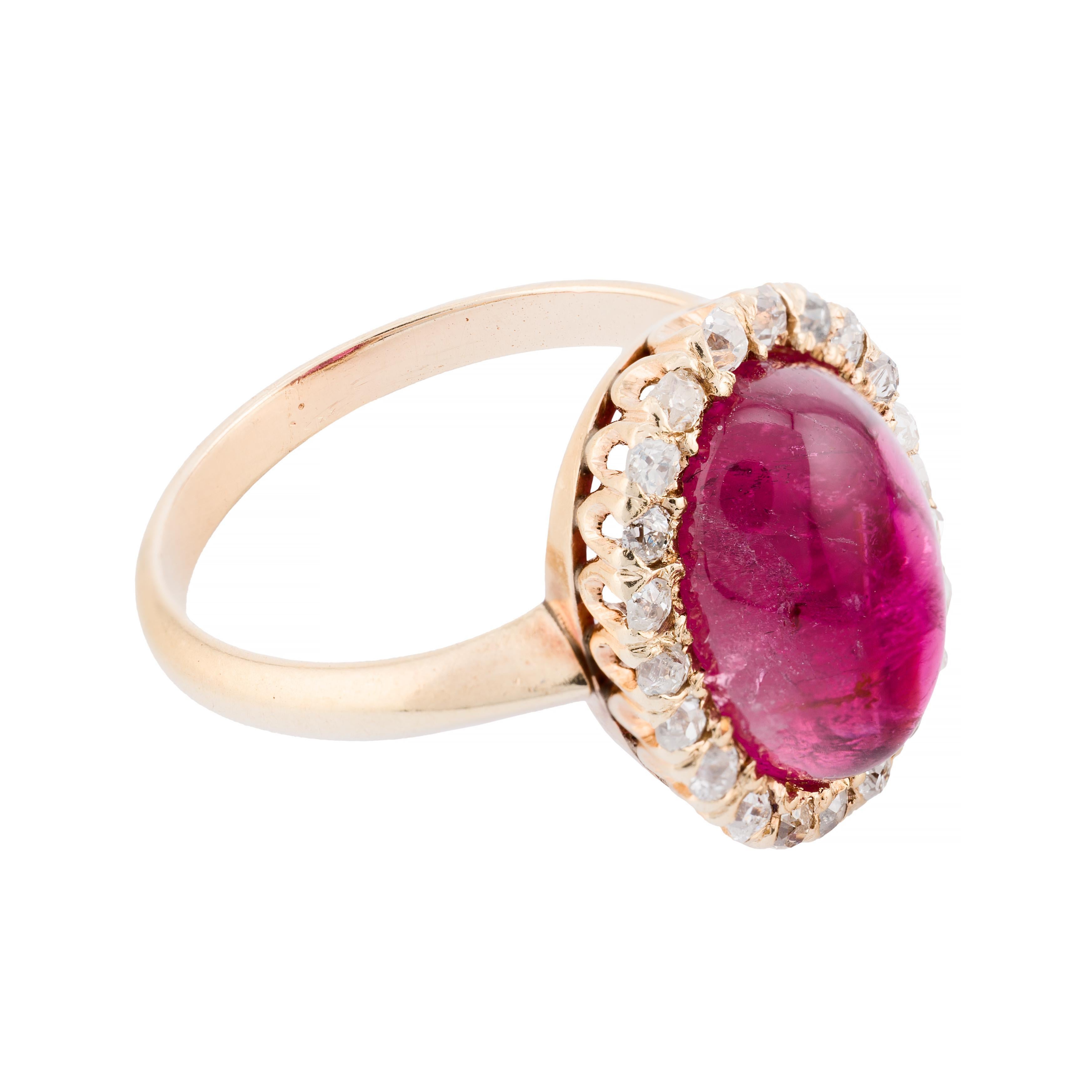 Aston Estate Jewelry Presents:

A captivating statement ring showcasing a 5.40 carat pink tourmaline, expertly cut in a cabochon style. The vibrant centerpiece is surrounded by 0.84 carats of old mine cut diamonds, graded H color and SI1