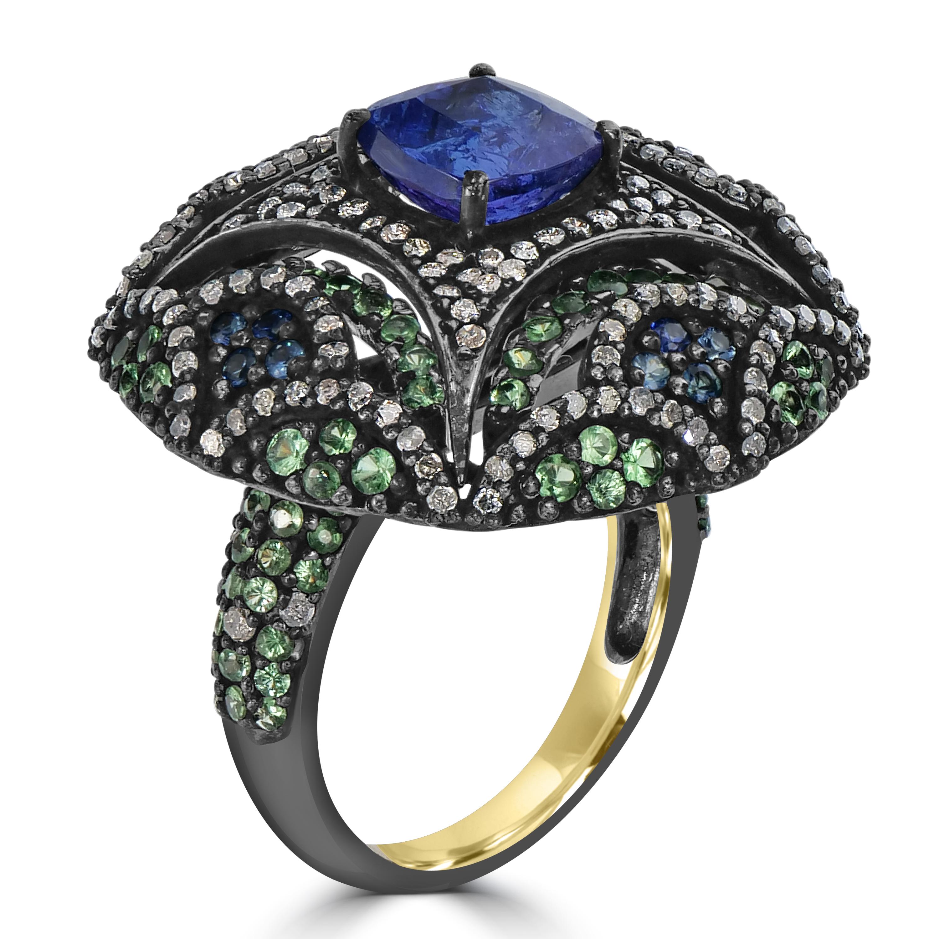 Step into the opulent world of the Victorian 5.72 Cttw. Tanzanite, Sapphire, Tsavorite, and Diamond Cocktail Ring — a harmonious blend of vintage charm and contemporary sophistication. At its heart, a resplendent tanzanite takes center stage,