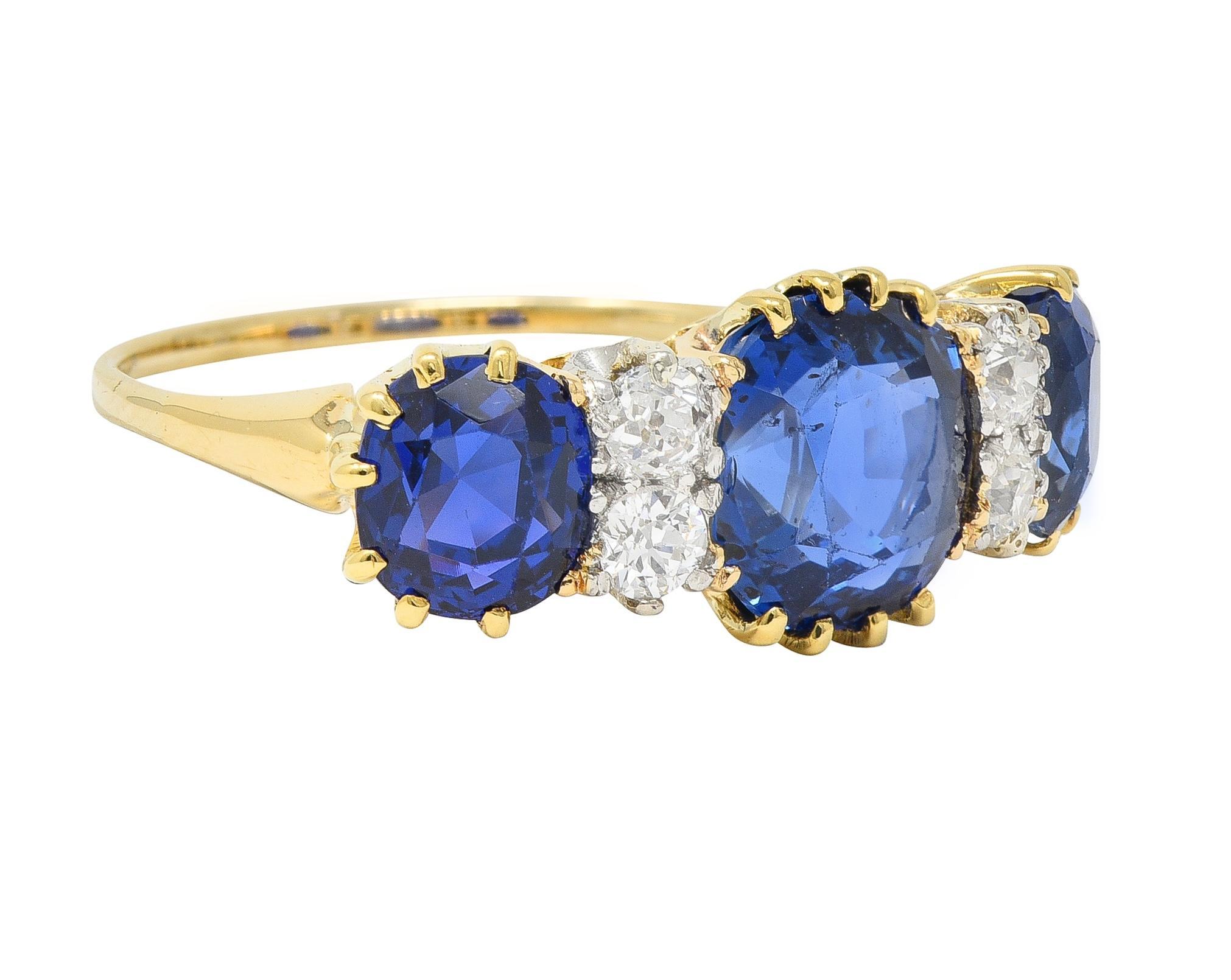 Designed as a band ring with cushion cut sapphires and diamonds prong set in pattern east to west
Center sapphire weighs approximately 2.73 carats - additional sapphires weigh 2.64 carats total
Natural Burmese in origin with no indications of heat