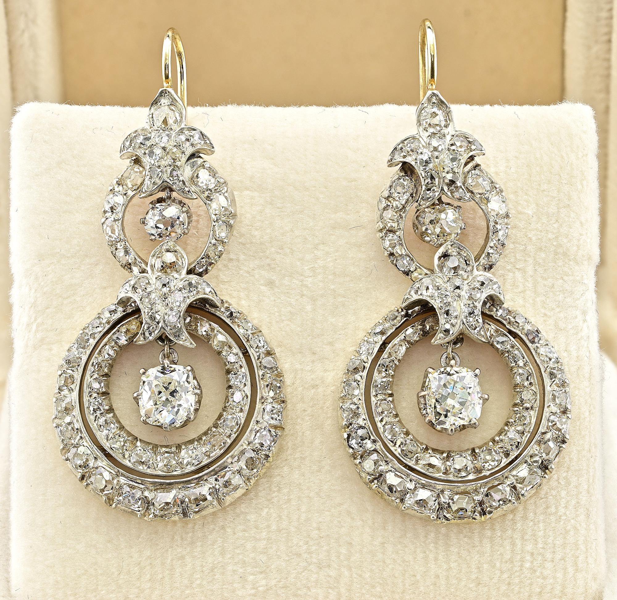 This magnificent pair of Diamond drop earrings are Victorian era, 1870 circa
Hand crafted during the time of solid 18 KT gold silver topped
They articulate into a distinctive circular shape displaying fine workmanship loaded with opulence of bright