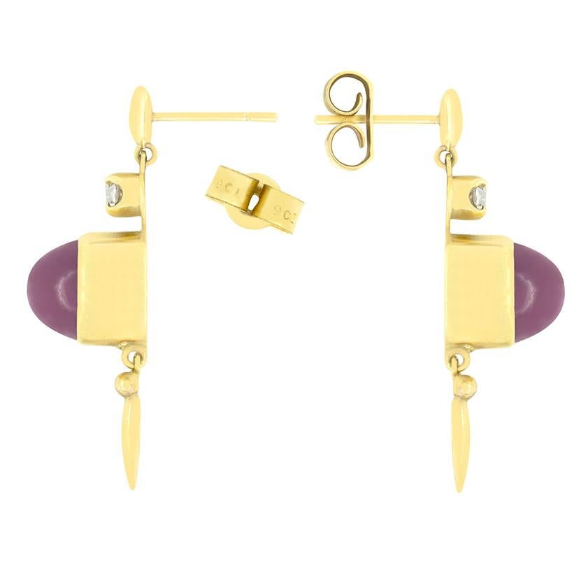 Dating back to the 1900s, this wonderful pair of Victorian drop earrings feature two enchanting star rubies. Crafted in 15 carat yellow gold the earrings are of a simple design with the two 6.00 carat cabochon rubies as the stars of the show. Each