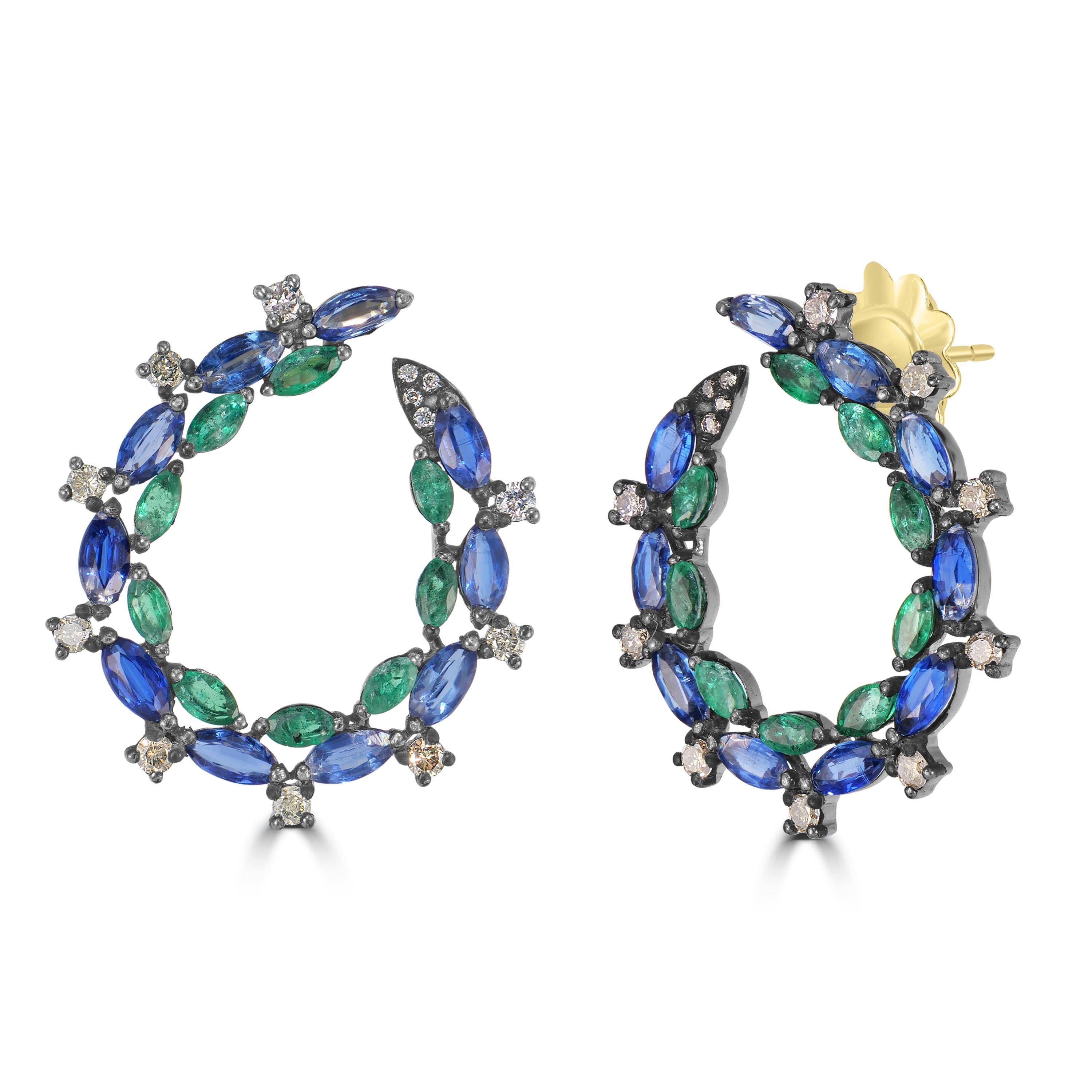 Introducing our Victorian 6.3 Cttw. Emerald, Kyanite, and Diamond Hoop Earrings – a mesmerizing blend of captivating gemstones and exquisite craftsmanship.

These hoop earrings redefine elegance with a unique design that showcases the arch in