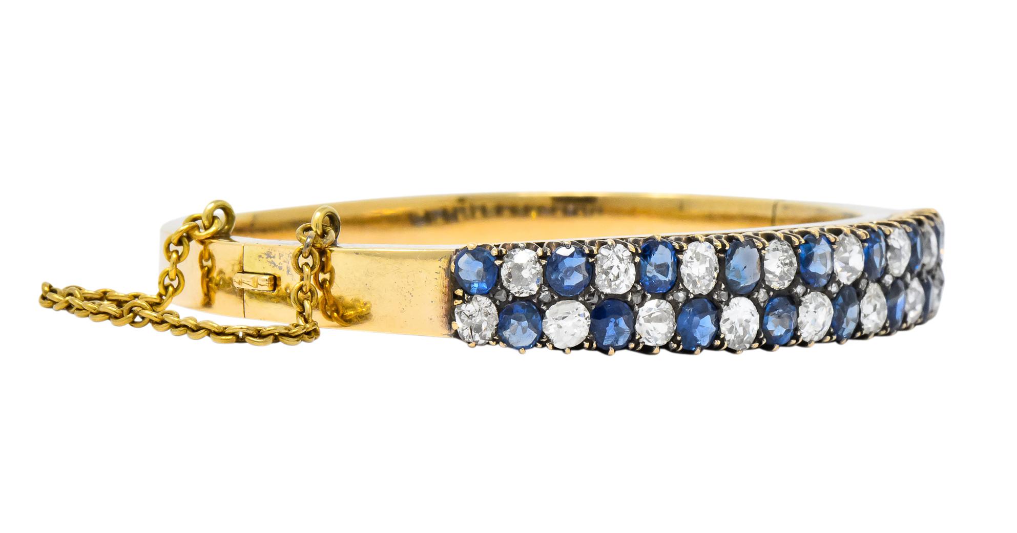 Designed as a hollow hinged bangle bracelet with chain safety and concealed clasp

Claw set to front with old mine cut diamonds and sapphires with rose cut diamond accents

Sapphires weigh approximately 3.90 carats total, transparent medium-light