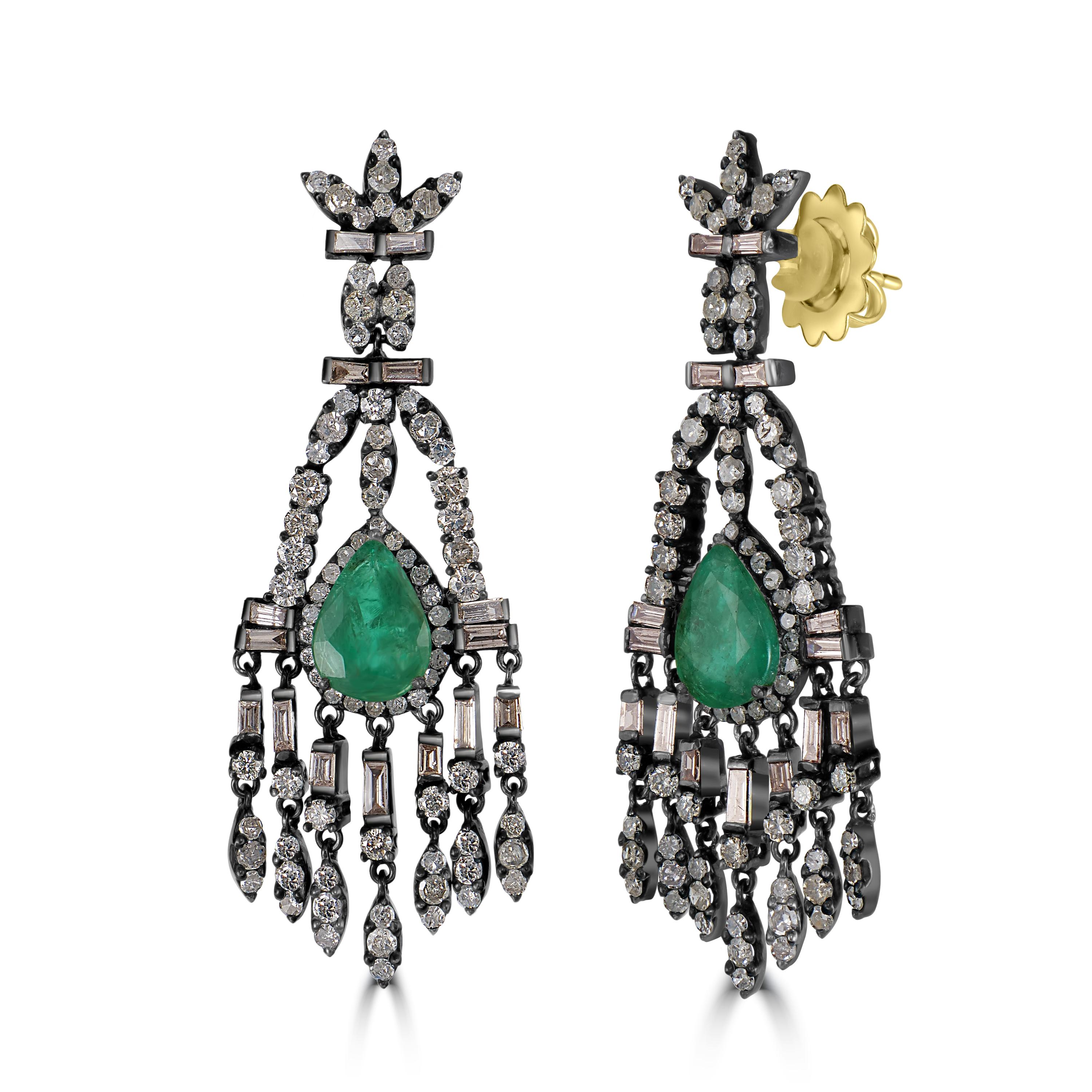 Indulge in the exquisite beauty of our Victorian Emerald and Diamond Floral Chandelier Earrings, a stunning testament to timeless elegance and sophistication.

These captivating chandelier earrings feature a meticulously crafted three-leaf black