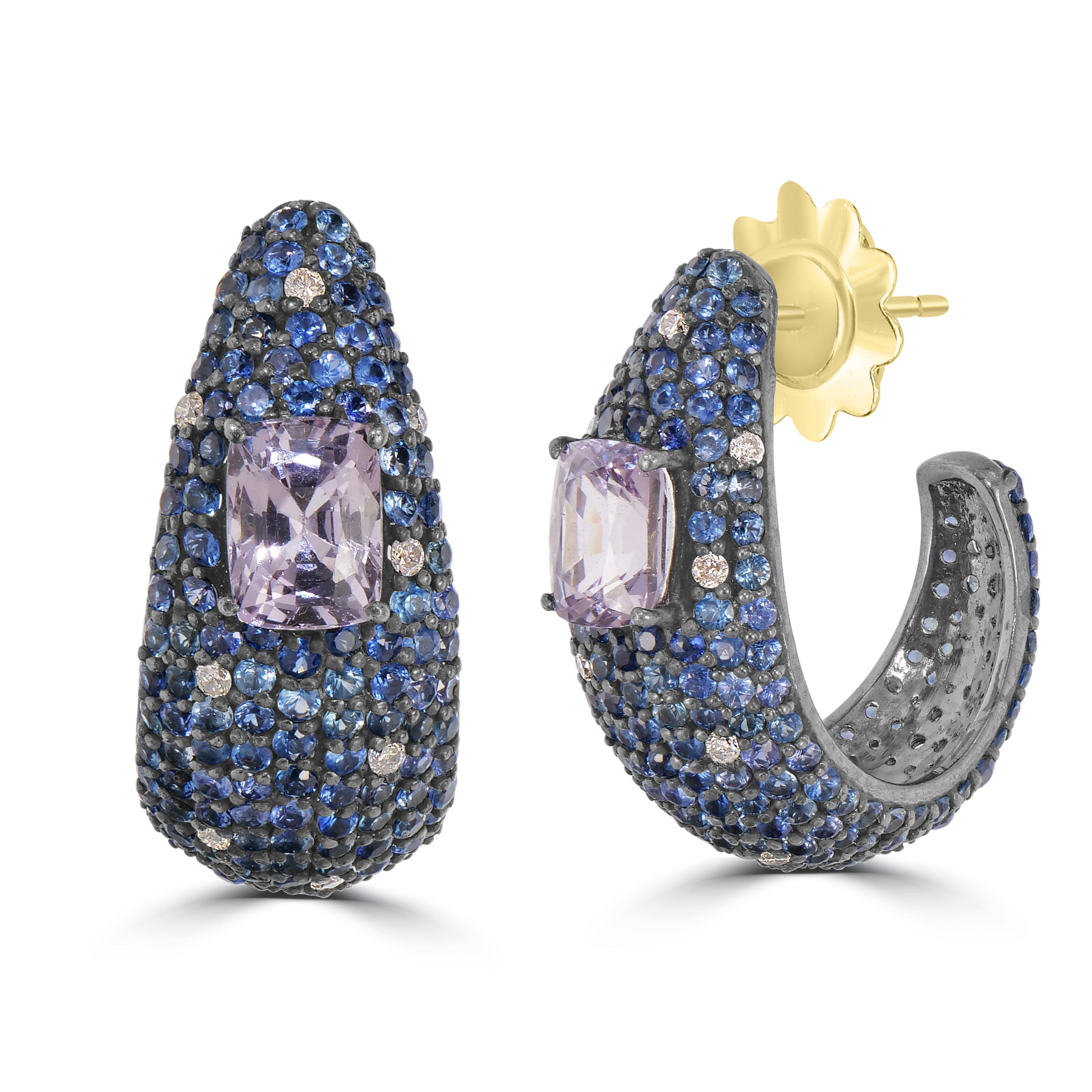Introducing our Victorian 7.94 Cttw. Blue Sapphire, Spinel, and Diamond Hook Stud Earrings – a captivating fusion of elegance and sophistication.

These stunning stud earrings boast a unique curved design, adorned with a dazzling array of round blue