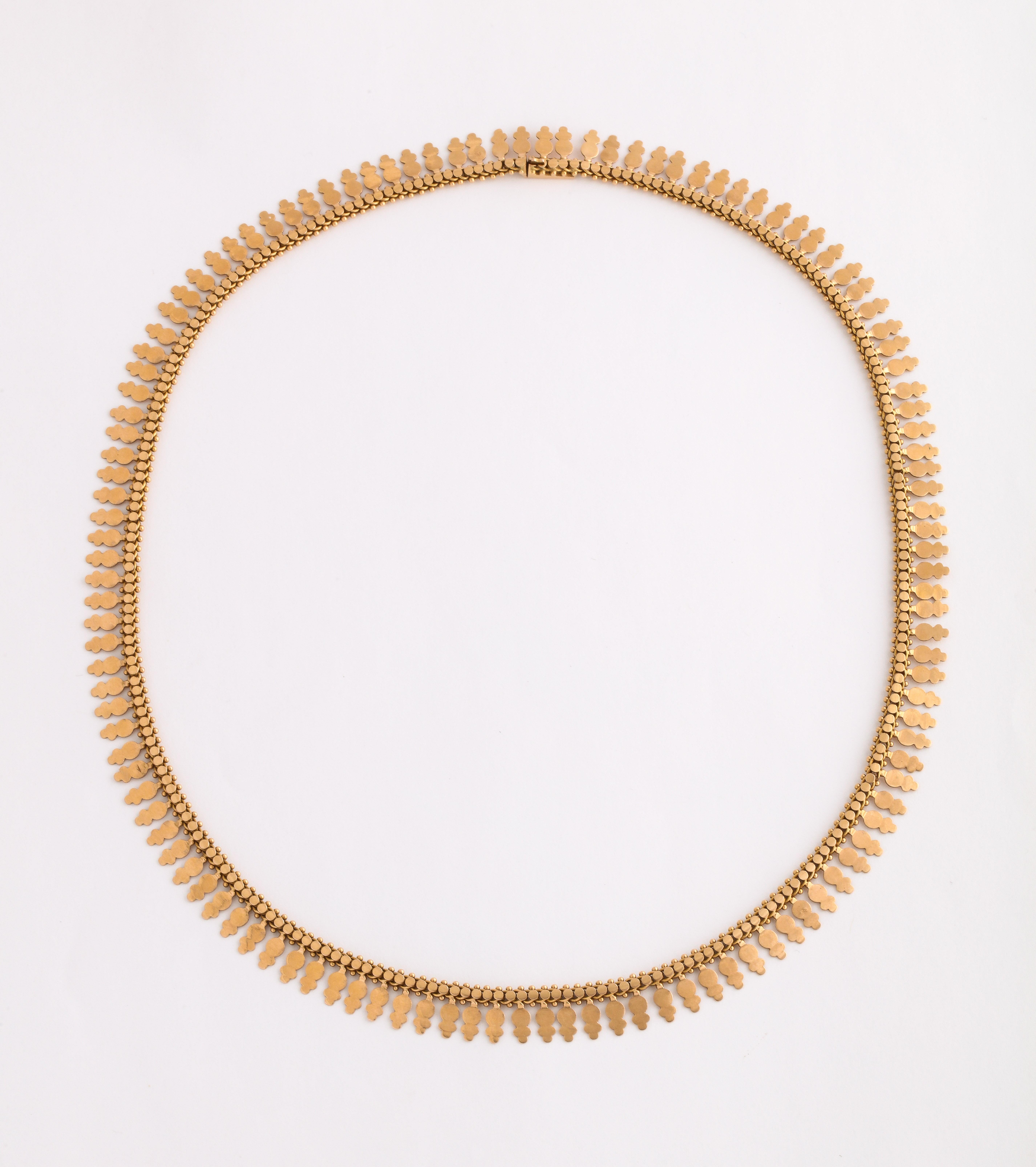 A flexible, sleek 18 Kt Gold chain in abstract fringe design was made in France in c. 1870.
French jewelers are known to be exceptional jewelry masters and have had this reputation for hundreds of years. The marvelous attraction of this chain is hat