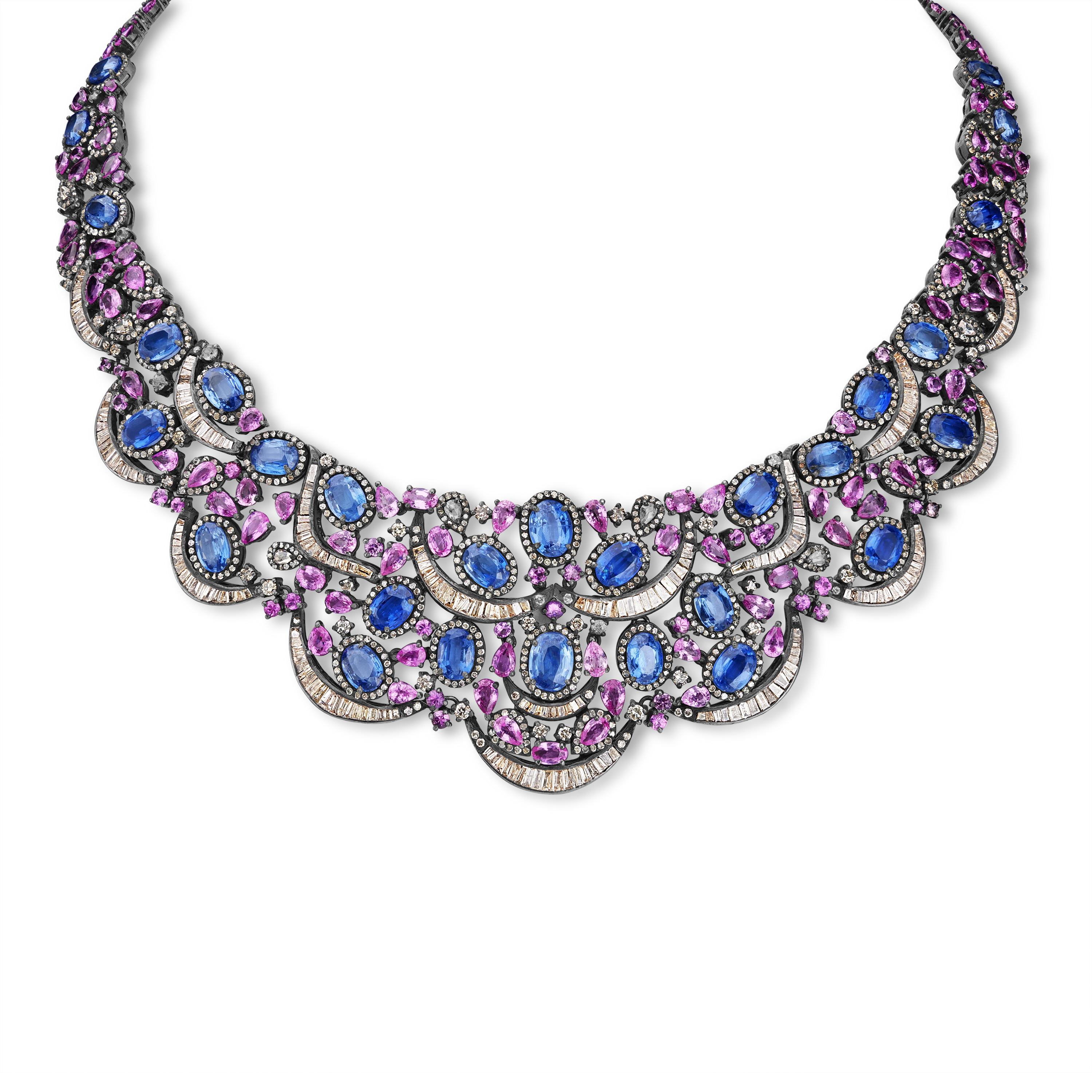 Unveil the epitome of luxury with our Victorian 82 Cttw. Kyanite, Pink Sapphire, and Diamond Choker Necklace. This opulent piece is a masterpiece of craftsmanship and design, blending the classic elegance of Victorian aesthetics with modern