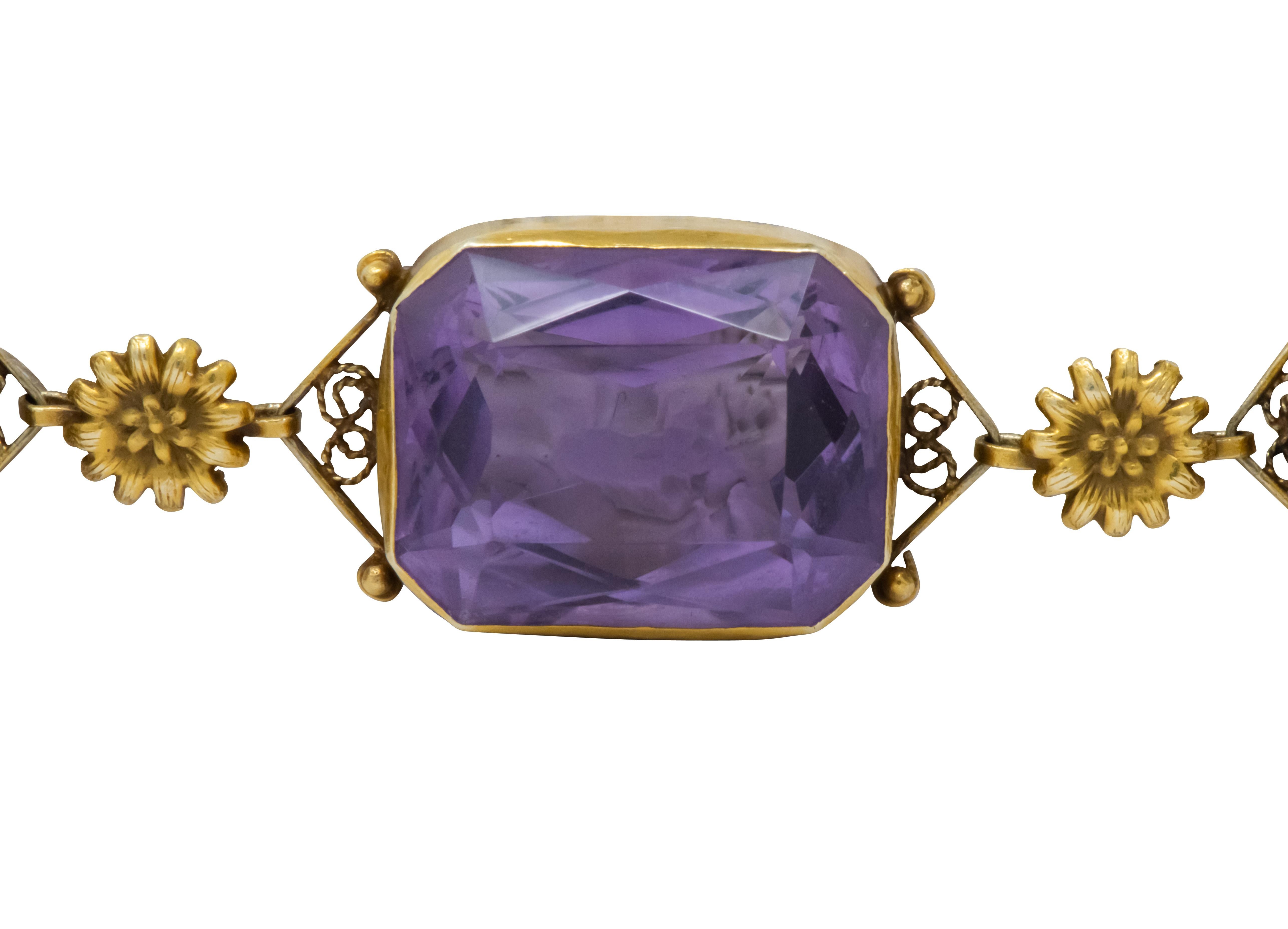 Featuring five rectangular cushion cut amethysts weighing approximately 83.50 carats total, medium light purple in color and very well matched

Amethysts are bezel set in delicate gold frames accented by gold flower links and gold bead