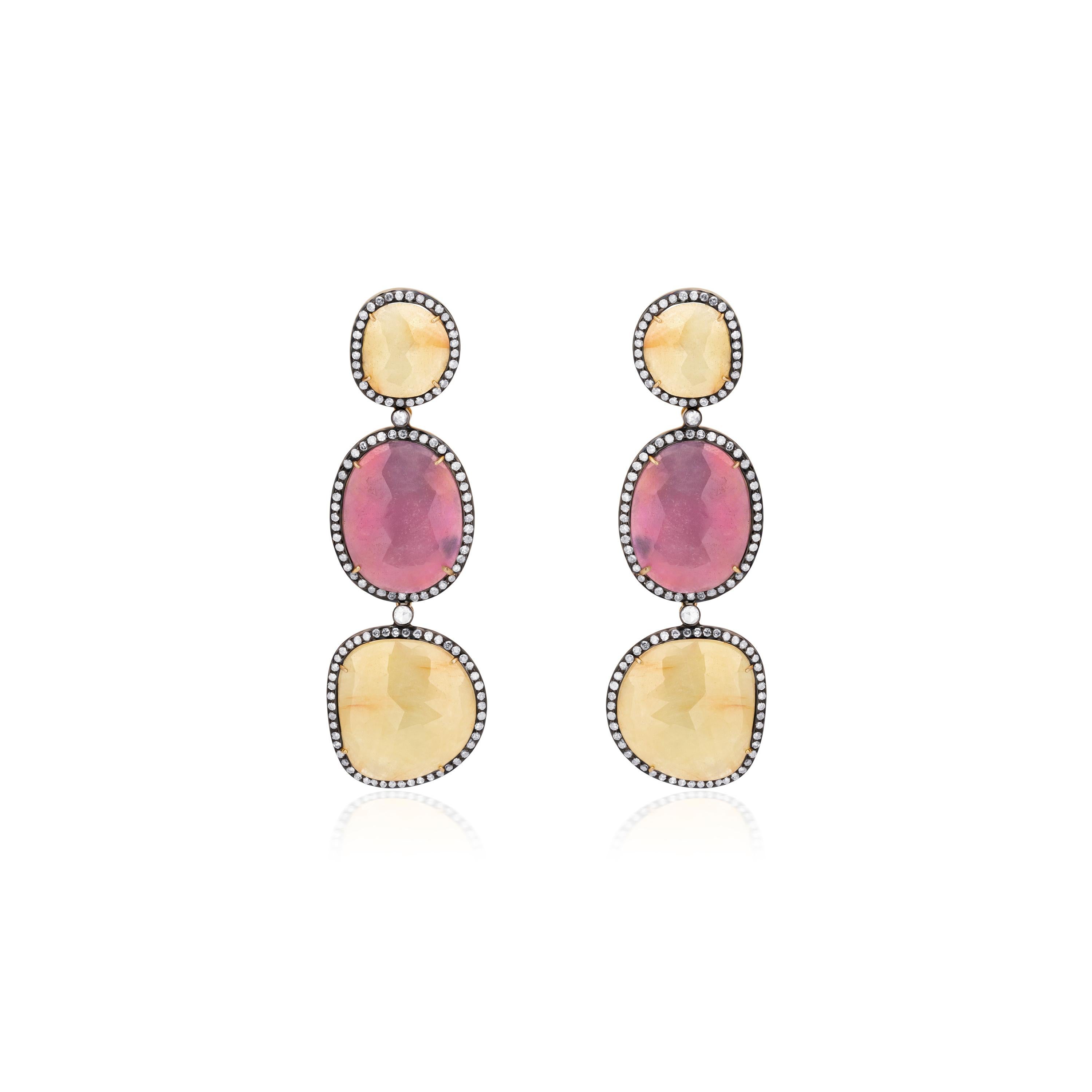 The gleam of sapphires and sparkling diamonds is always a wining combination. These Victorian inspired jewels crafted in 18K gold and 925 sterling silver feature faceted cabochons of pink and yellow sapphires graduating in diamond accentuated