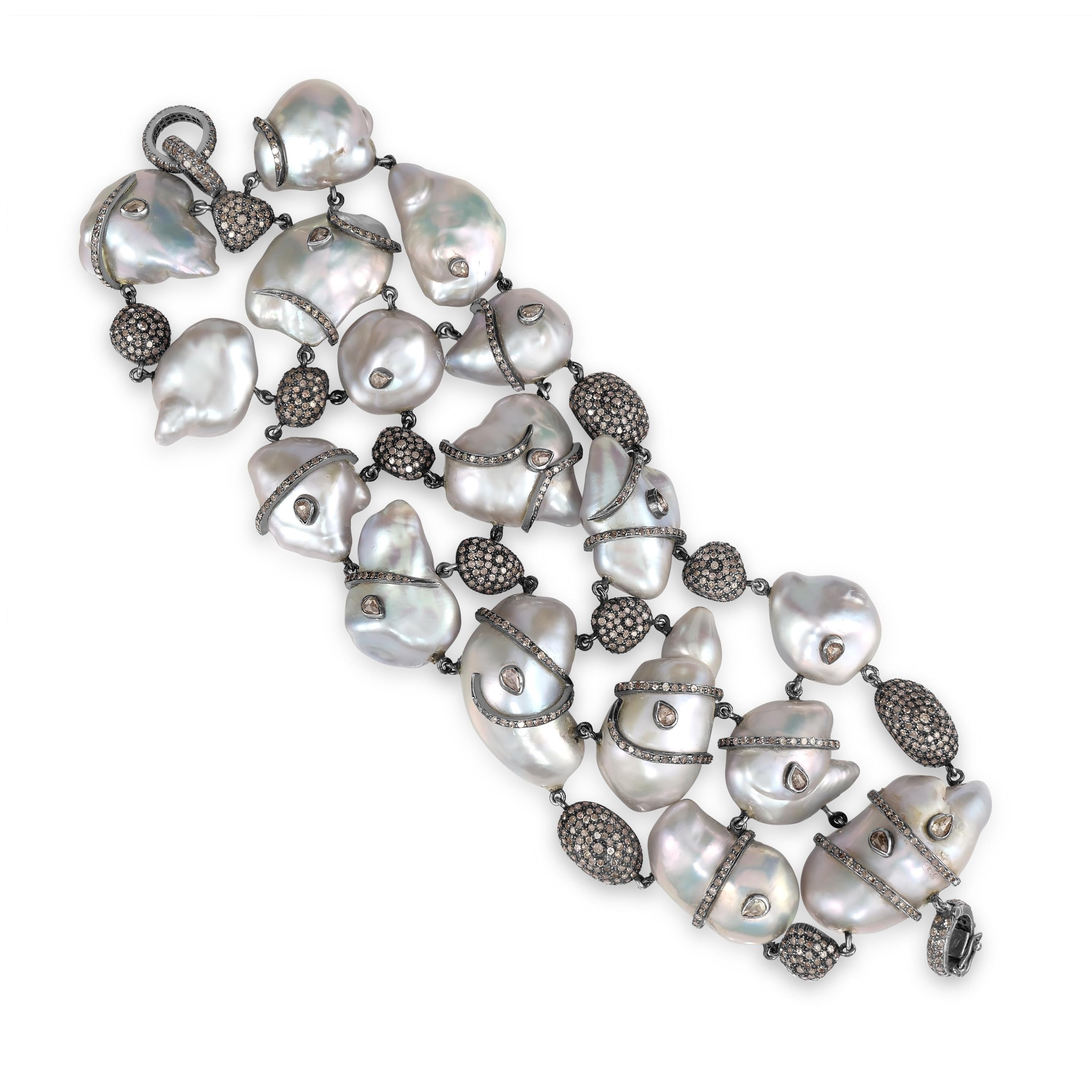 Introducing our exquisite Victorian Pearl and Diamond Beaded Bracelet, a luxurious piece that exudes elegance and sophistication.

Crafted with meticulous attention to detail, this stunning bracelet features heart-shaped pearls delicately wrapped in