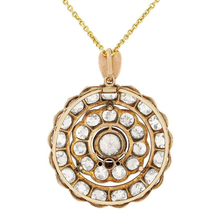 A mesmerising collection of old cut diamonds adorn this beautiful Victorian pendant. the biggest of the diamonds is set at the centre, weighing 1.00 carat stone. Surrounding the central stone is a double halo of diamonds. The first halo comprises of