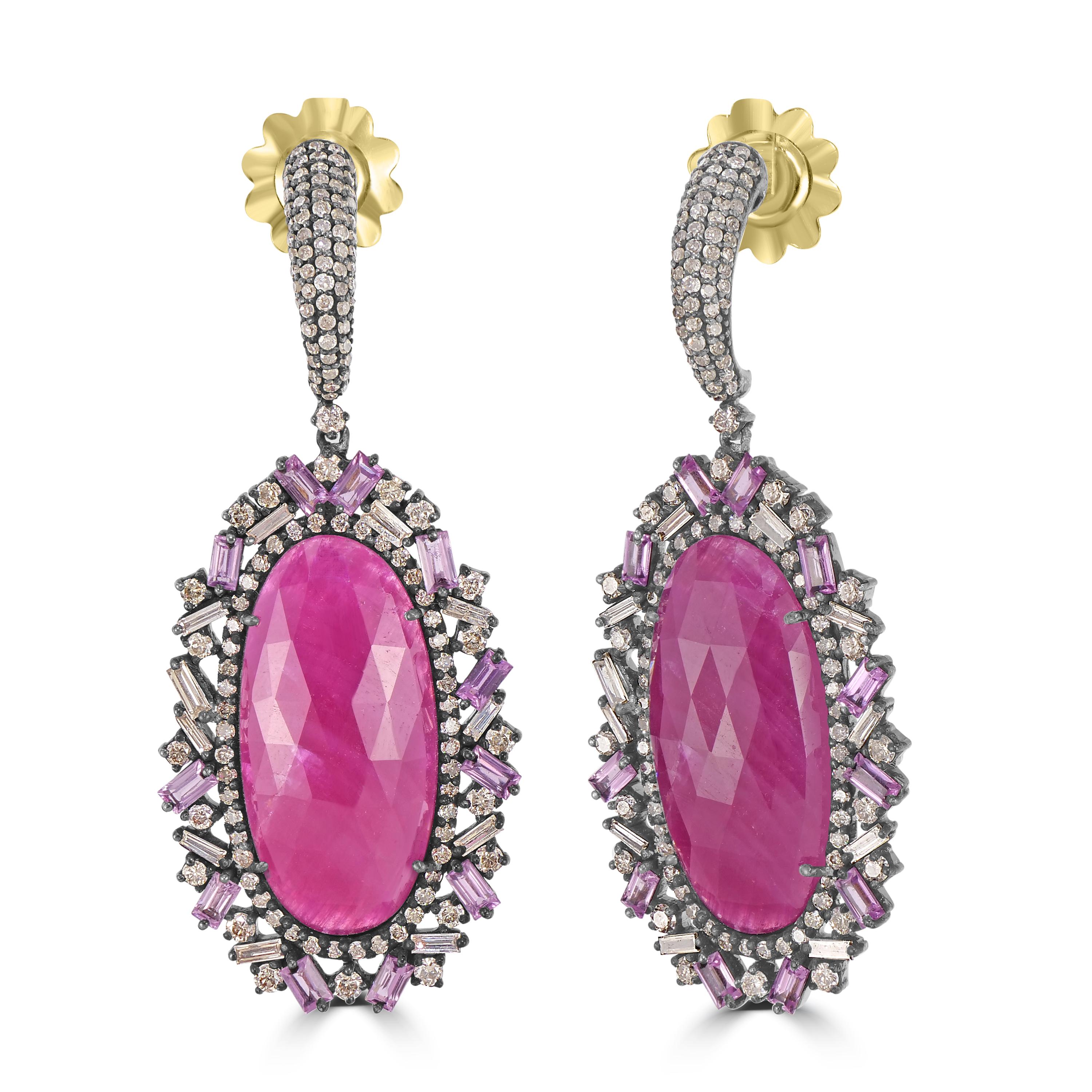 Step into the enchanting world of Victorian elegance with the exquisite Victorian 8.89 Cttw. Ruby, Pink Sapphire, and Diamond Dangle Earrings. These earrings are a testament to opulence and sophistication, showcasing a unique blend of rubies, pink