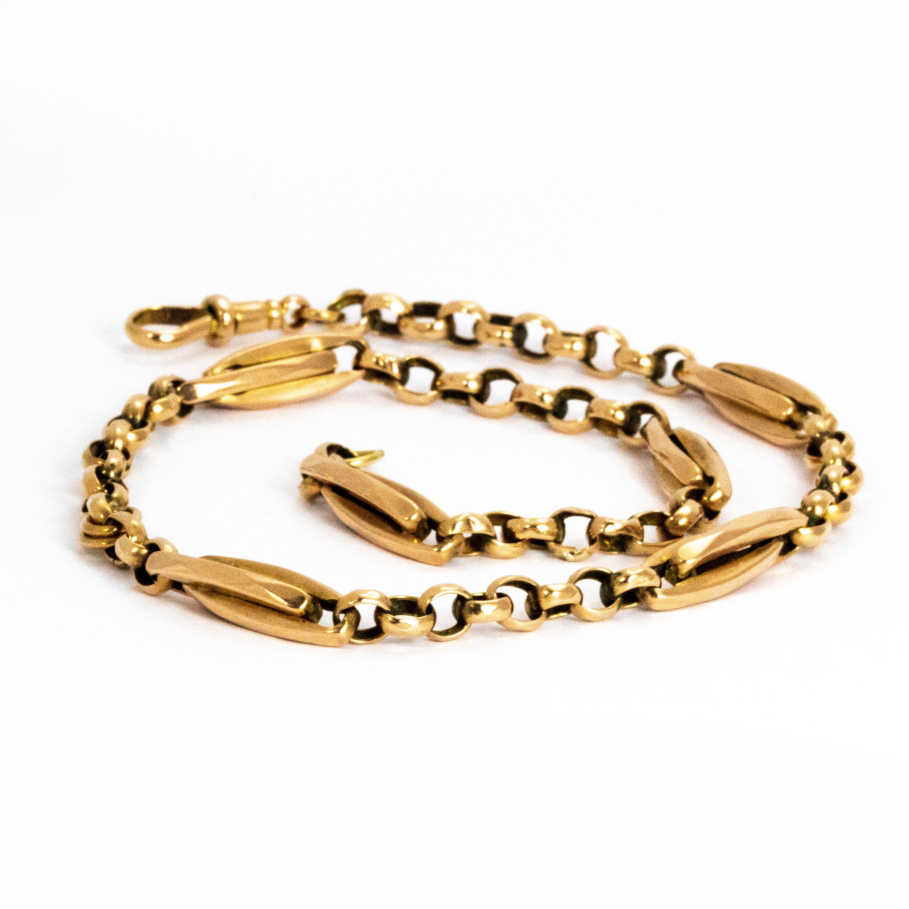 This Albert chain has chunky and decorative links connected with a simple chain. Modelled in 9ct gold. This chain is very versatile and can be used as a necklace or wrapped around the wrist to make a bracelet.

Length: 14 1/2 inches 