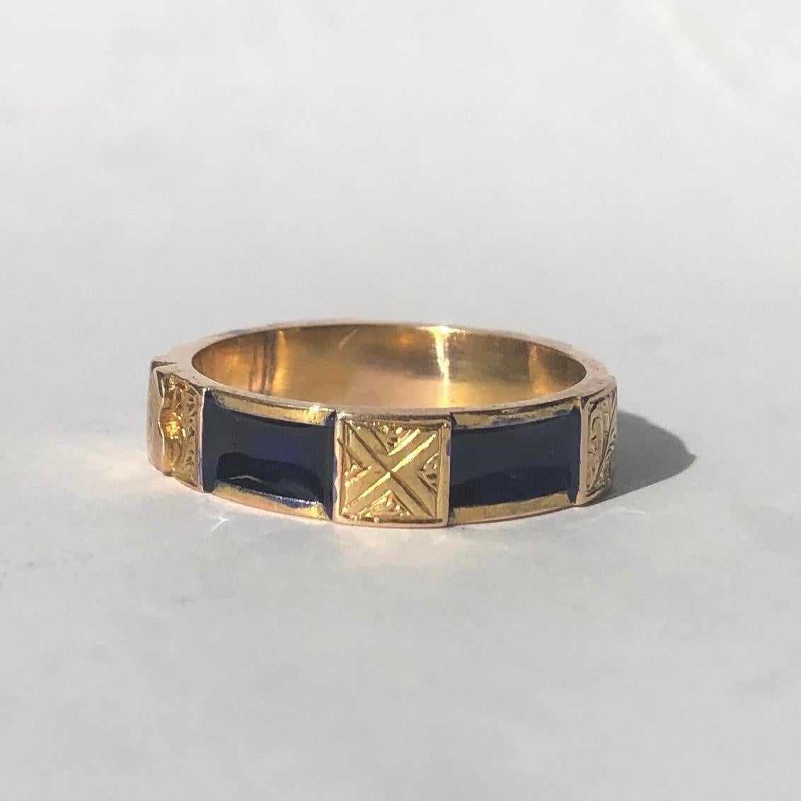 This superb antique Victorian ring is embossed with a fine shield motif at its front, and around the band there are engraved squares between immaculate sections of dark blue enamel. Modelled in 9 carat yellow gold. 

Ring Size: P 1/2 or 8
Band