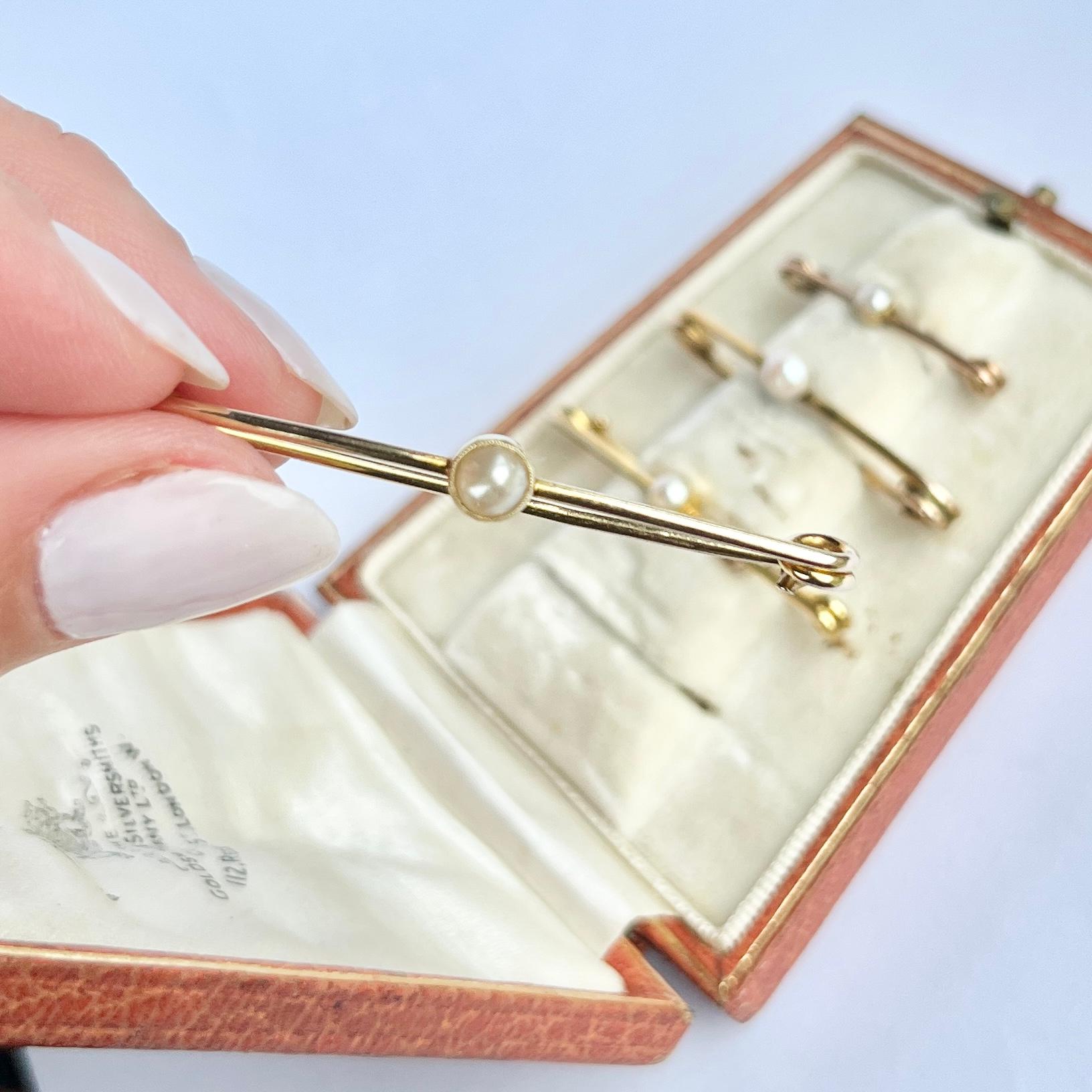 This gorgeous set comes with the original box. the safety pins are modelled in 9carat gold and set with a pearl. 

Largest Pin Length: 4.5cm
Smallest Pin Length: 2.5cm

Weight Pins Only: 5.37g